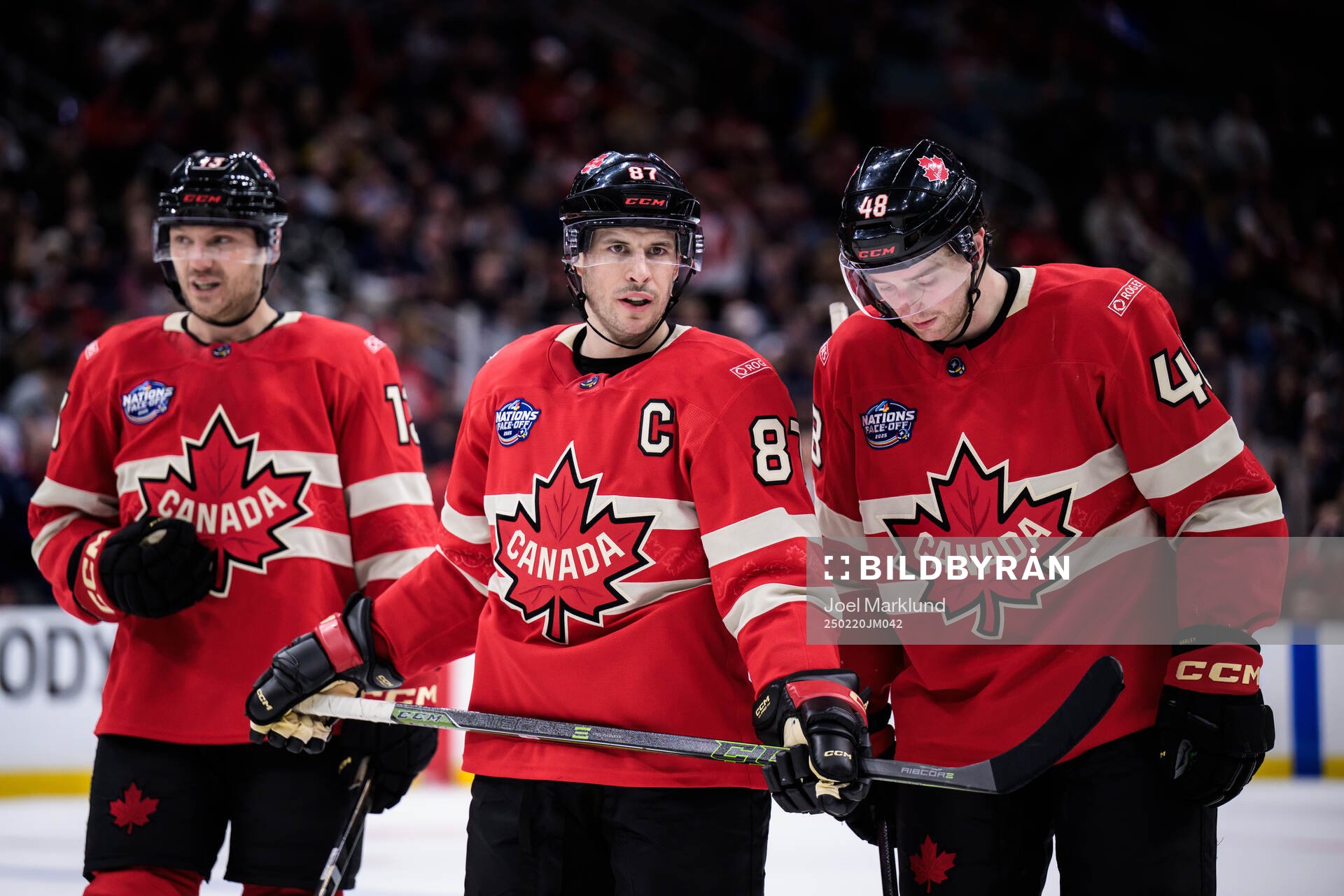 Sam Reinhart, Sidney Crosby and Thomas Harley of Canada