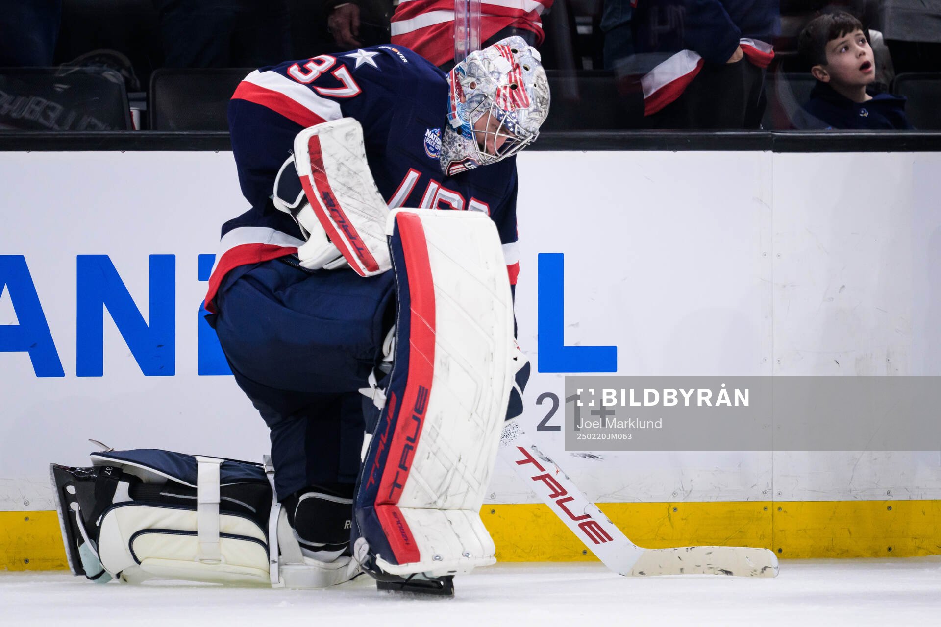 Goaltender Connor Hellebuyck of USA looks dejected