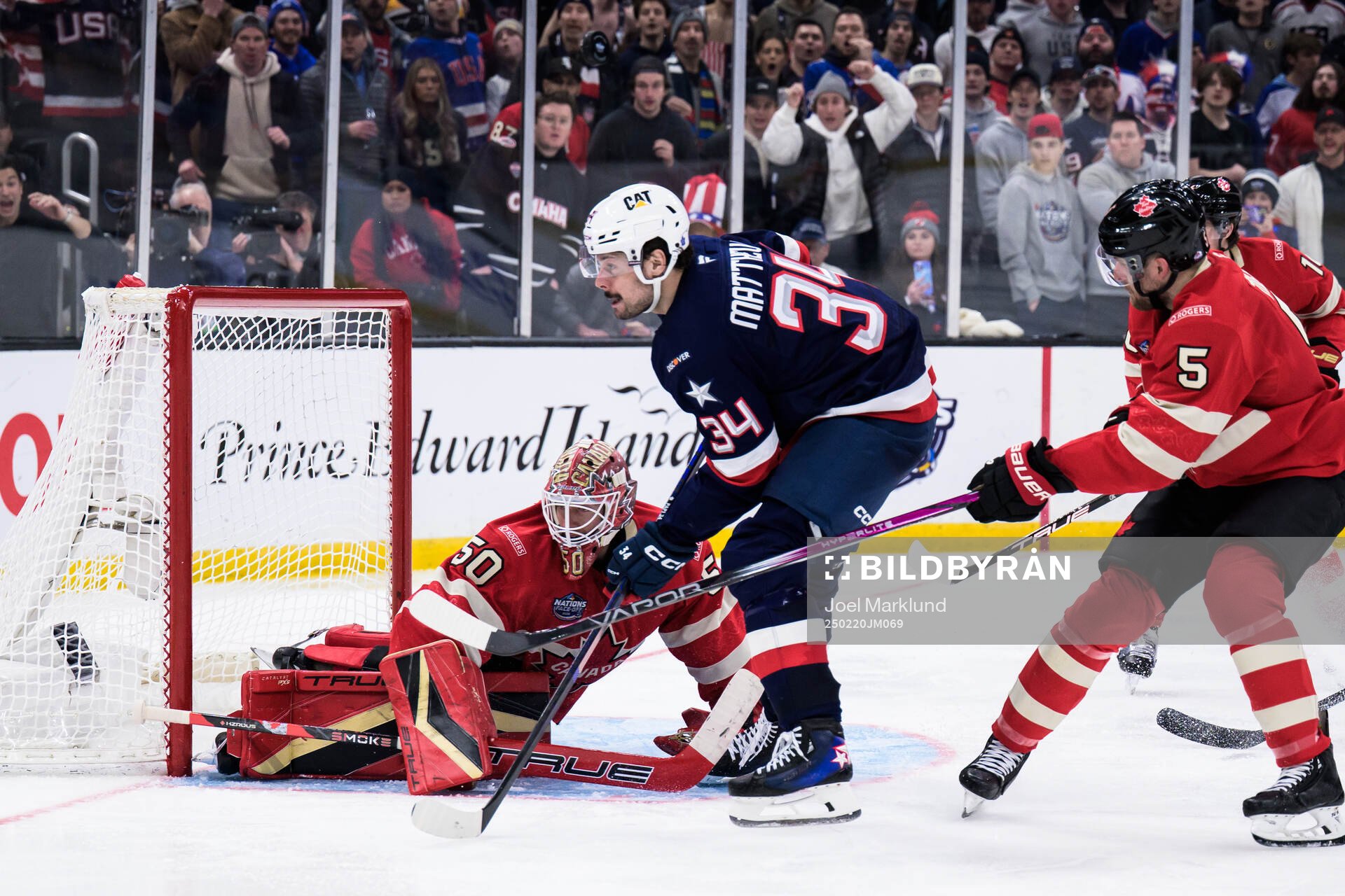 Goaltender Jordan Binnington of Canada and Auston Matthews