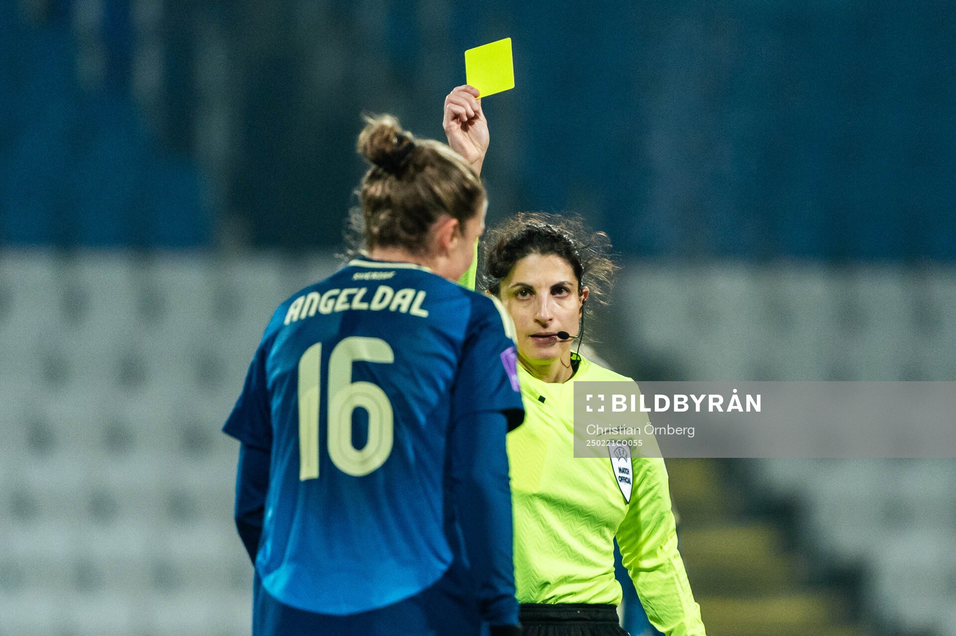 Filippa Angeldahl of Sweden is shown a yellow card from