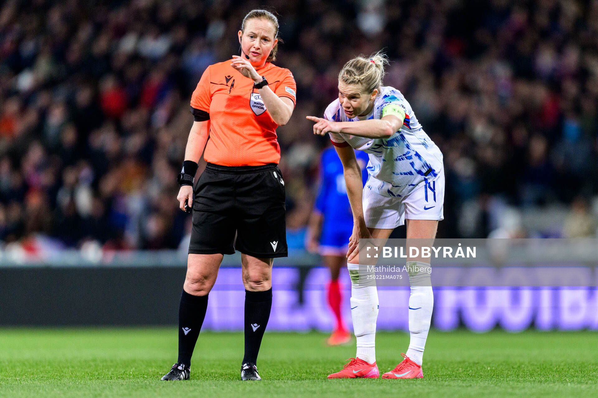 Referee Cheryl Foster and Ada Hegerberg of Norway
