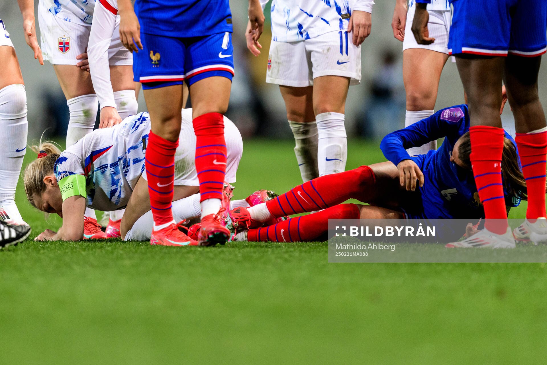 Ada Hegerberg of Norway and Sandie Toletti of France in pain