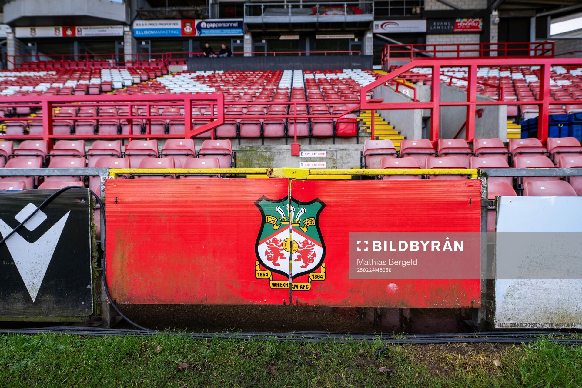The club Crest of Wrexham is seen below stands at