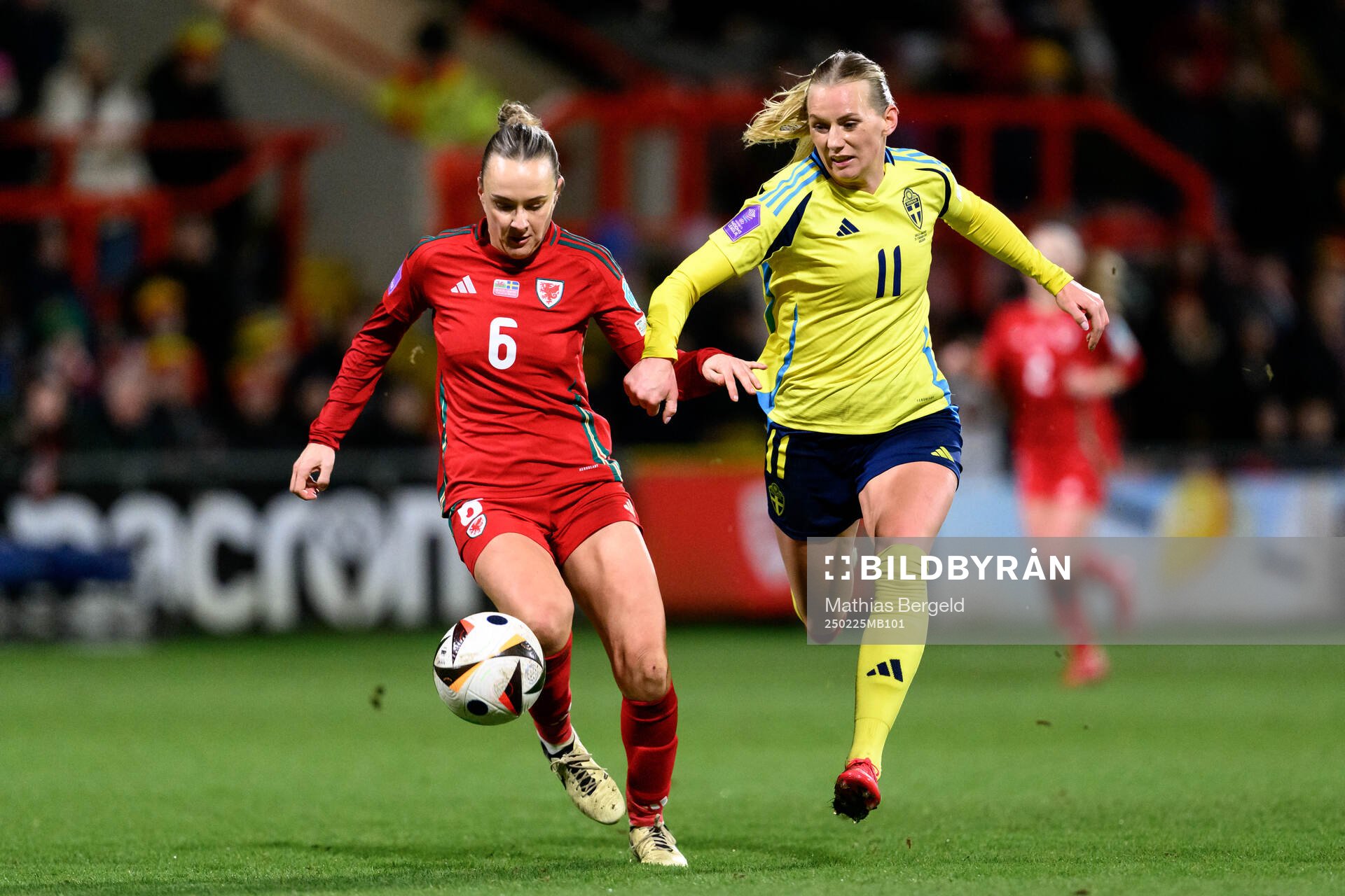 Josie Green of Wales and Stina Blackstenius of Sweden during the UEFA Women's Nations League football match between Wales and Sweden on February 25, 2025 in Wrexham.