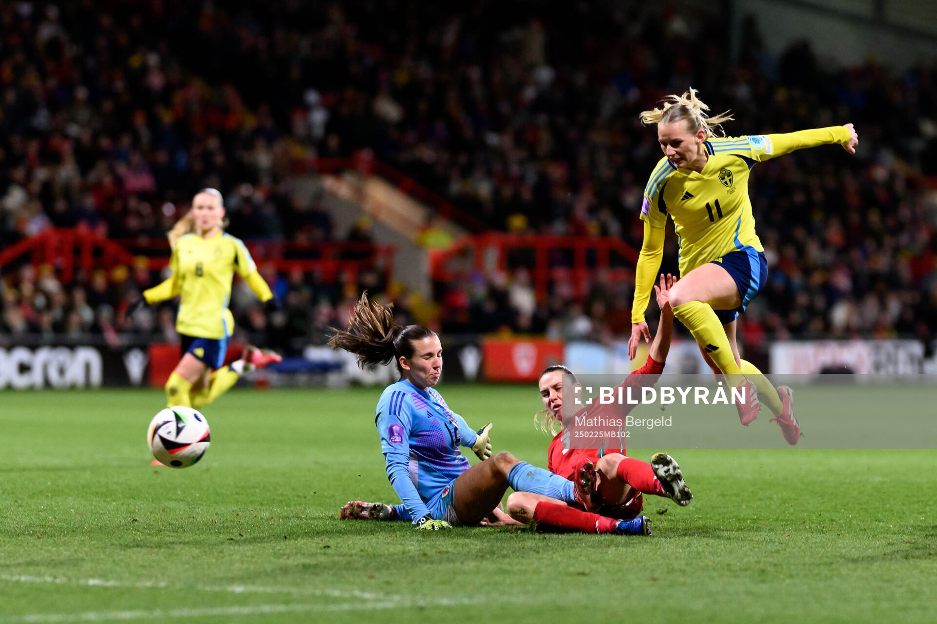 goalkeeper Olivia Clark and Gemma Evans of Wales against