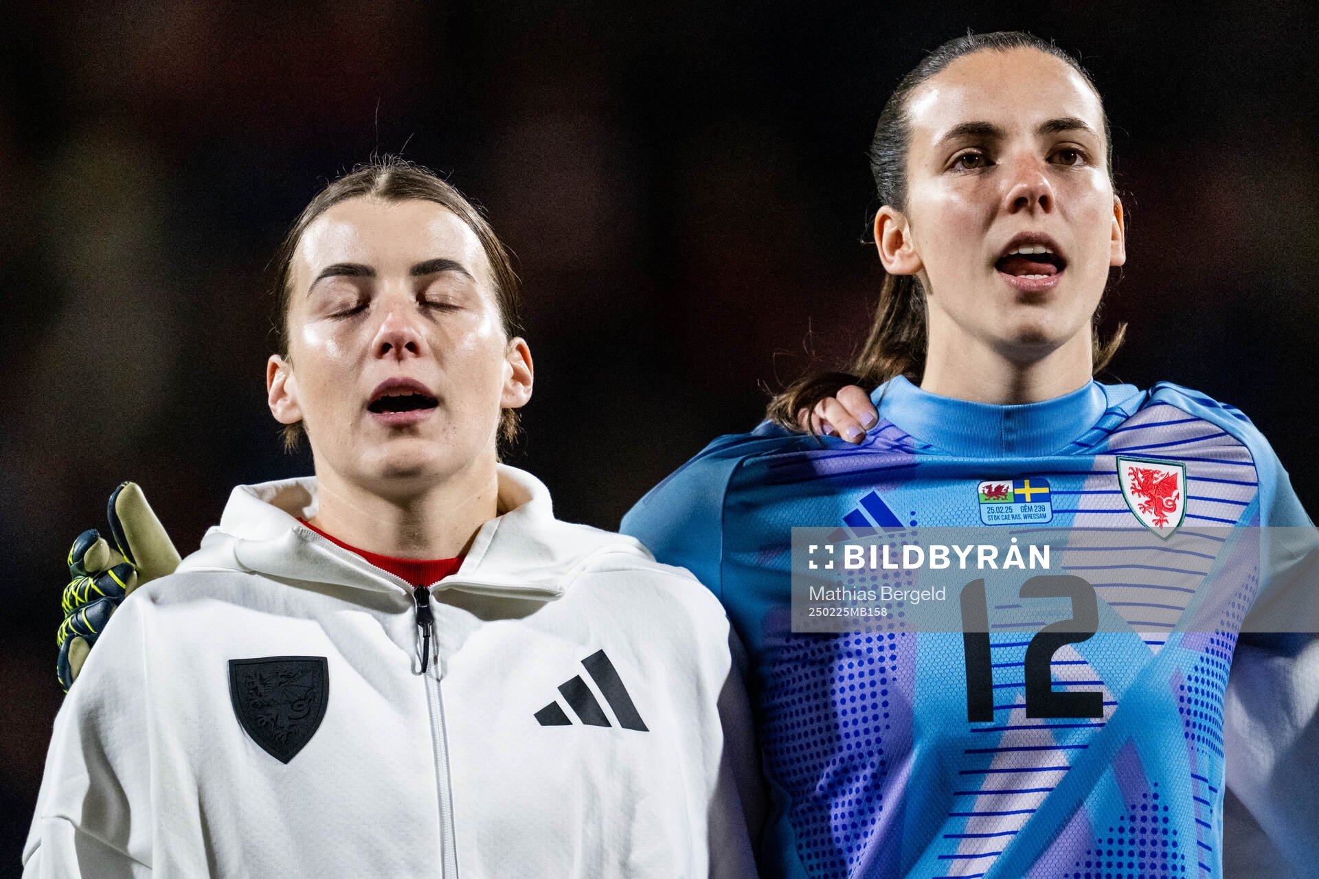 Angharad James and goalkeeper Olivia Clark of Wales
