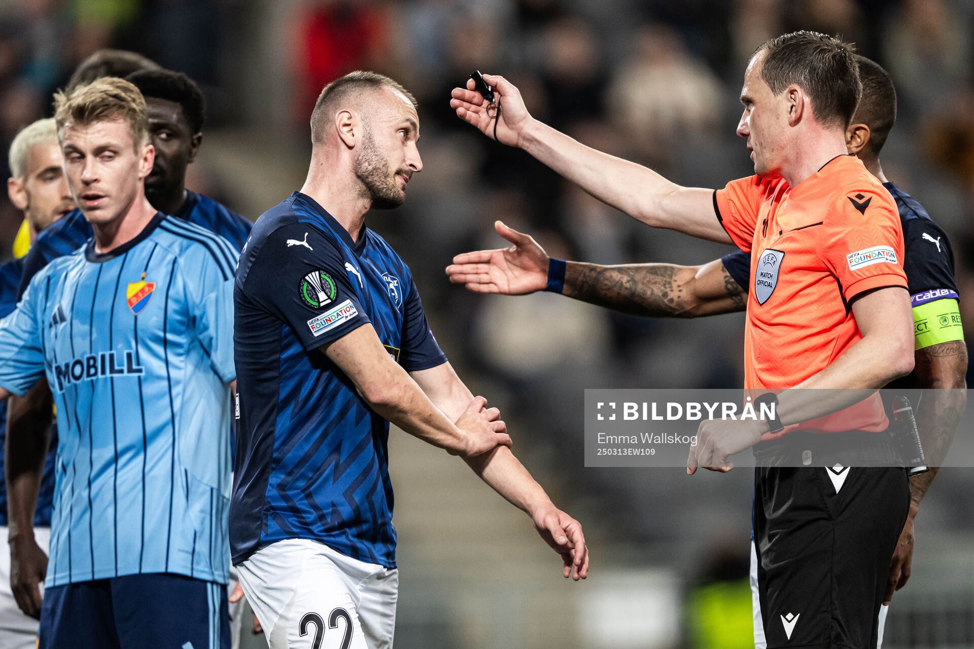 Muamer Tankovic of Pafos reacts against referee Sebastian Gishamer during the UEFA Conference League football match between Djurgården and Pafos on March 13, 2025 in Stockholm.