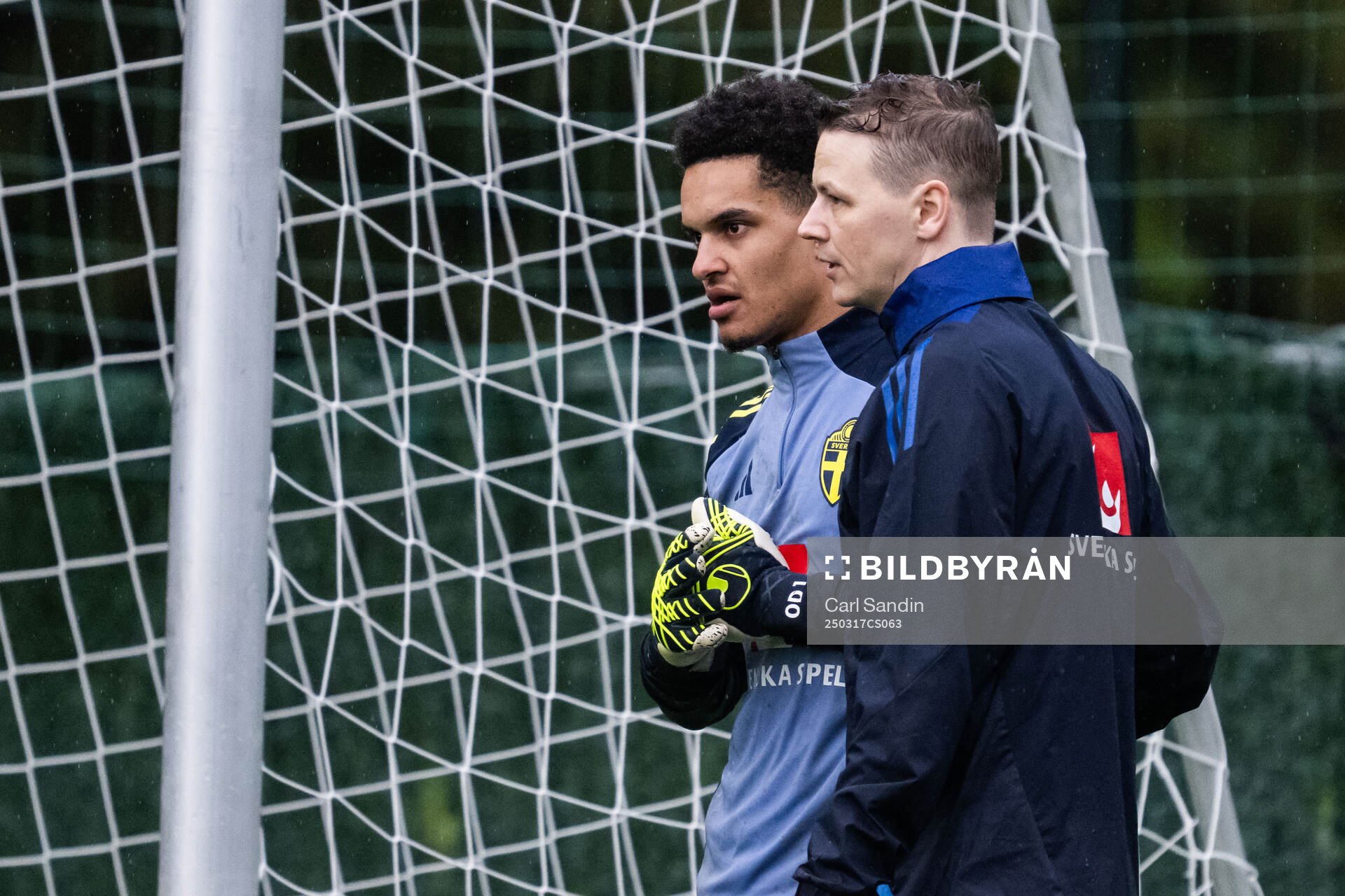 Goalkeeper Oliver Dovin and goalkeeper coach Maths