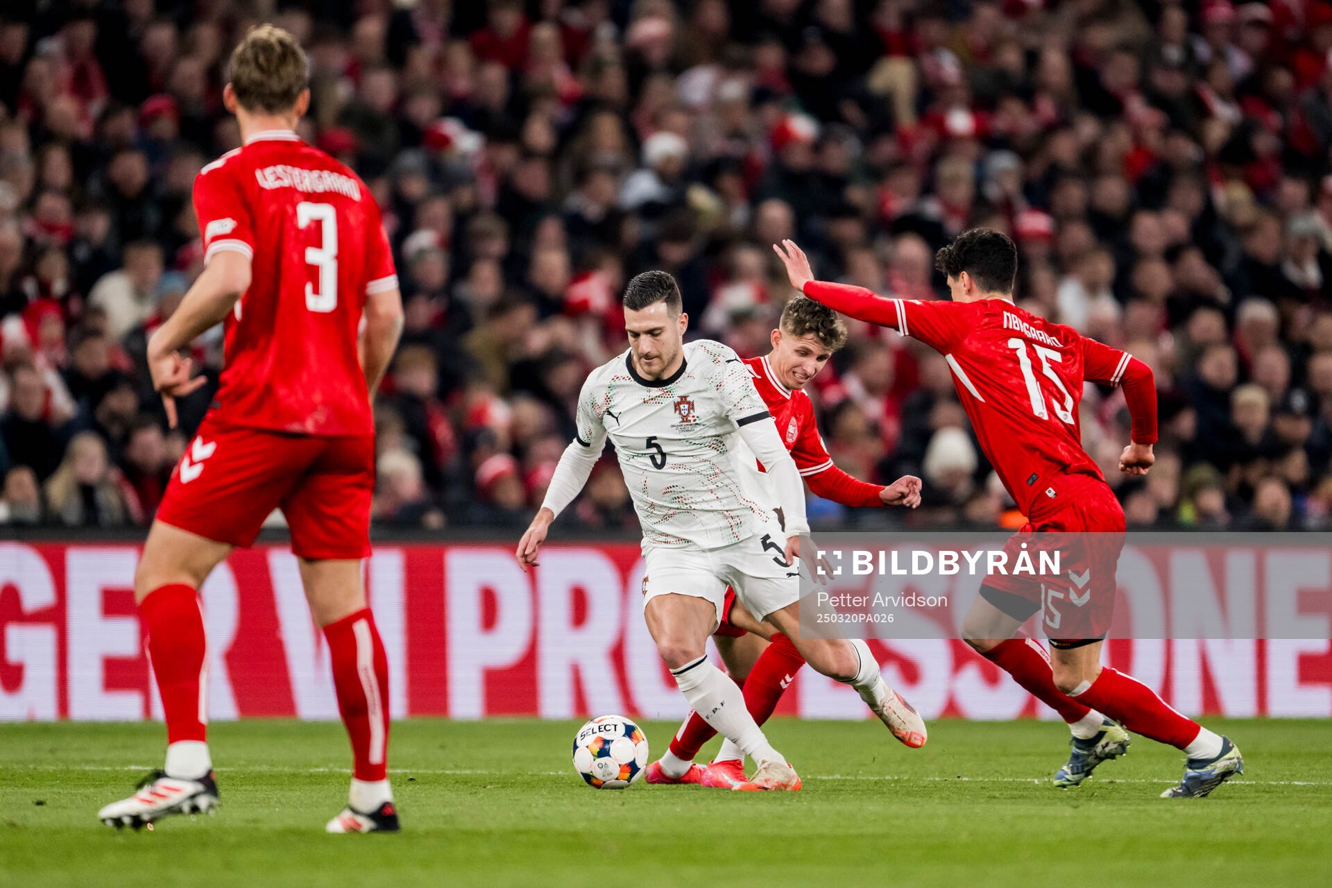 Diogo Dalot of Portugal and Christian Nørgaard of Denmark