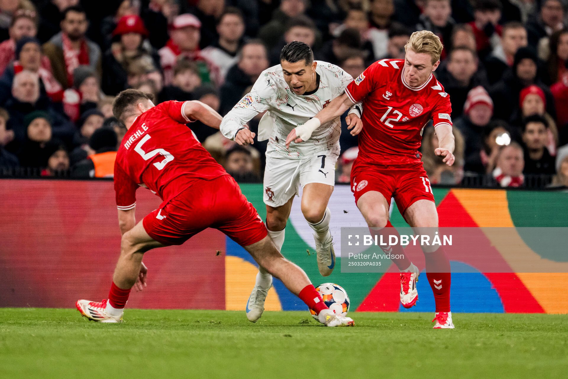 Joakim Mæhle and Mika Biereth of Denmark and Cristiano