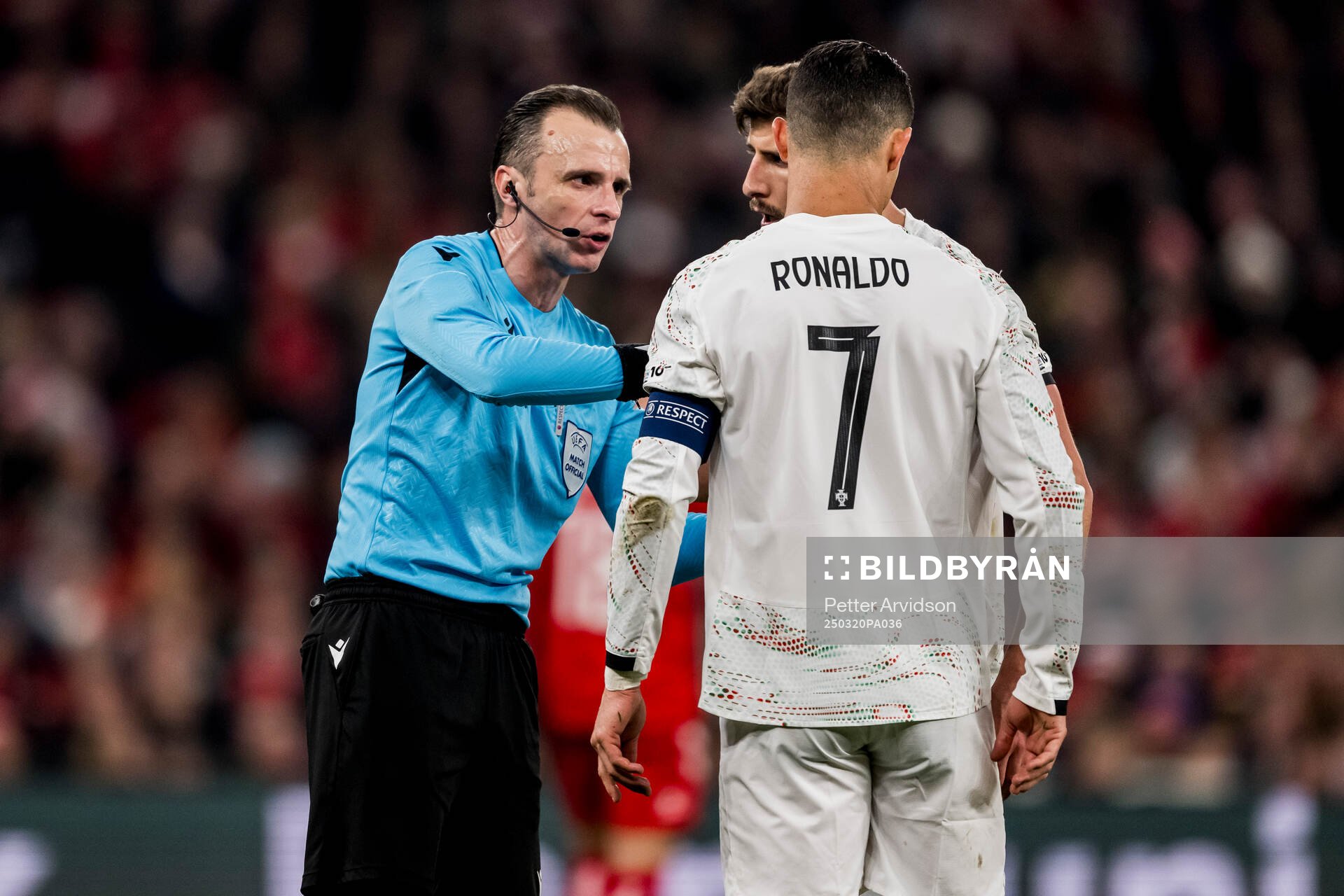 Referee Irfan Peljto and Cristiano Ronaldo of Portugal