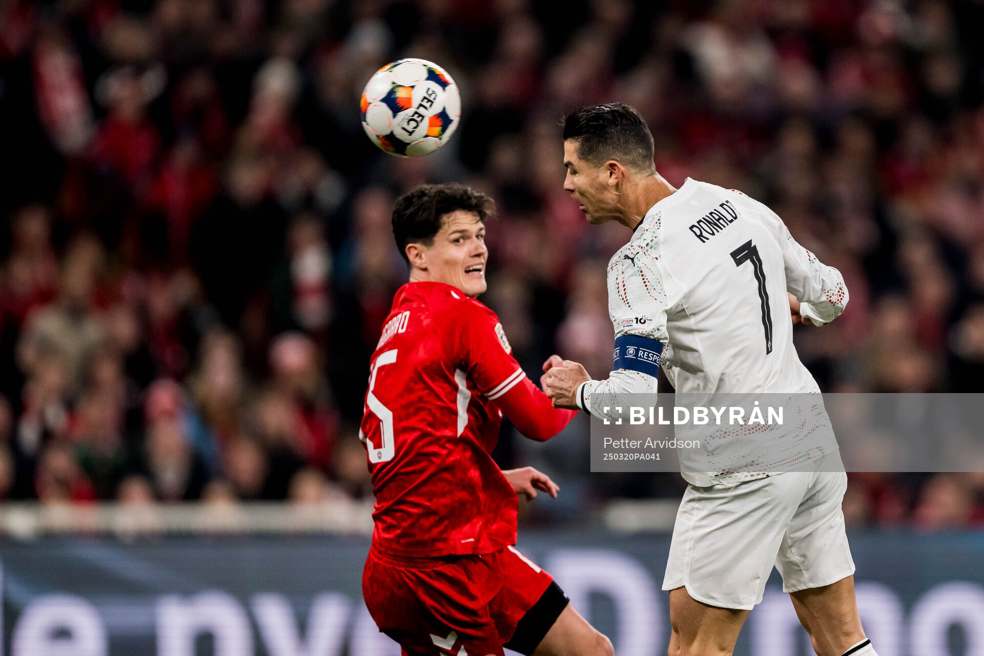 Christian Nørgaard of Denmark and Cristiano Ronaldo of