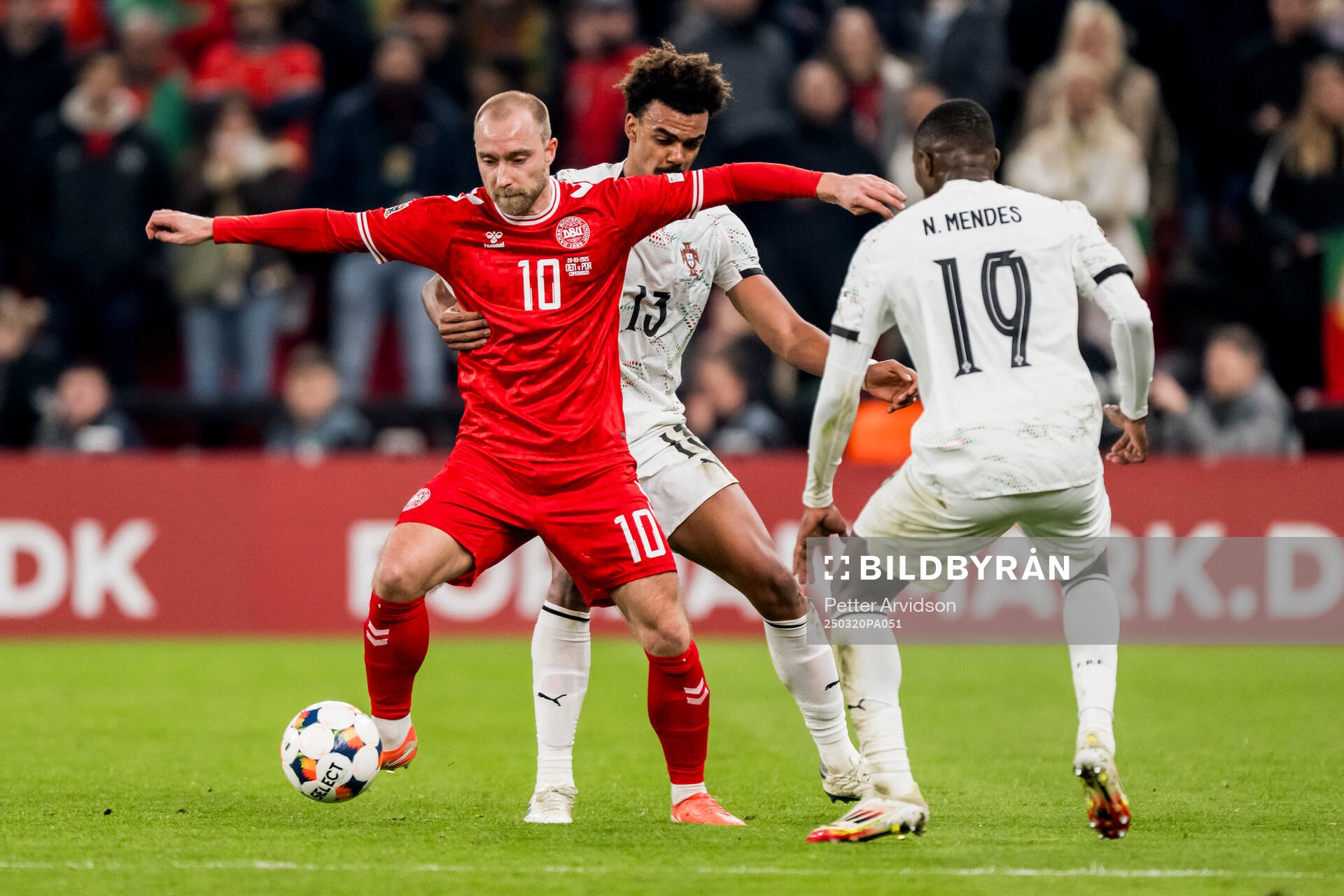 Christian Eriksen of Denmark and Renato Veiga of Portugal