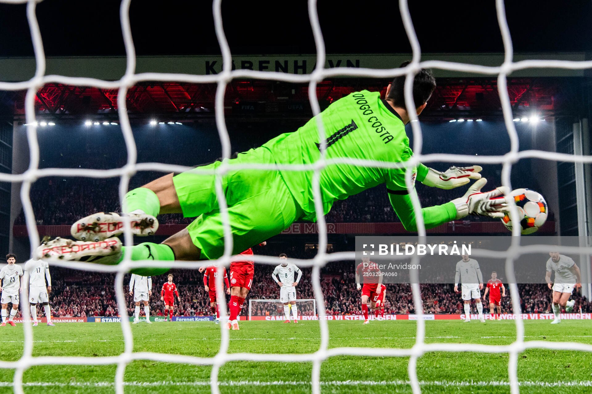 Goalkeeper Diogo Costa of Portugal saves a penalty against