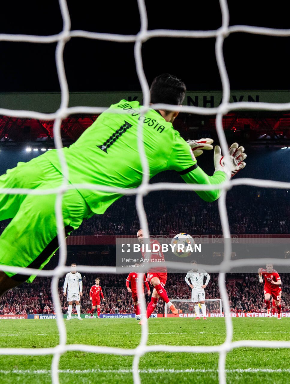 Goalkeeper Diogo Costa of Portugal saves a penalty against
