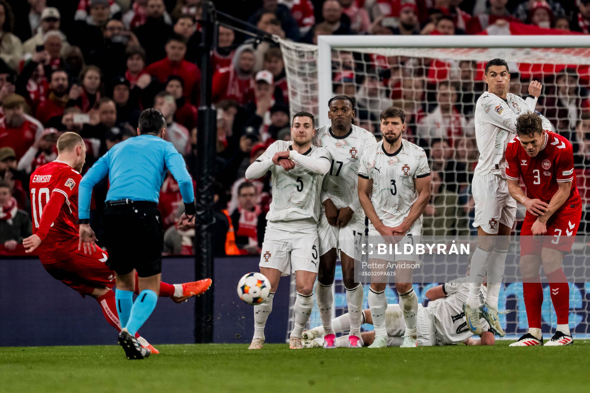 Christian Eriksen of Denmark and Diogo Dalot, Rafael Leao,