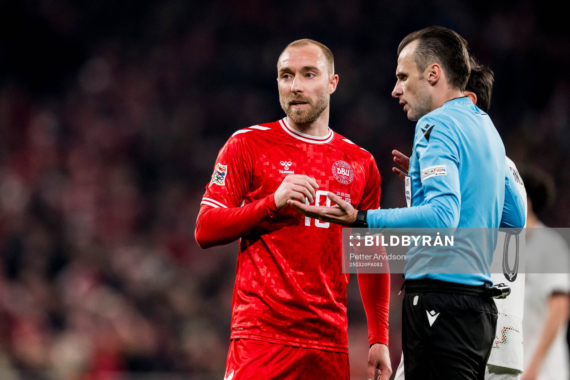 Christian Eriksen of Denmark and referee Irfan Peljto