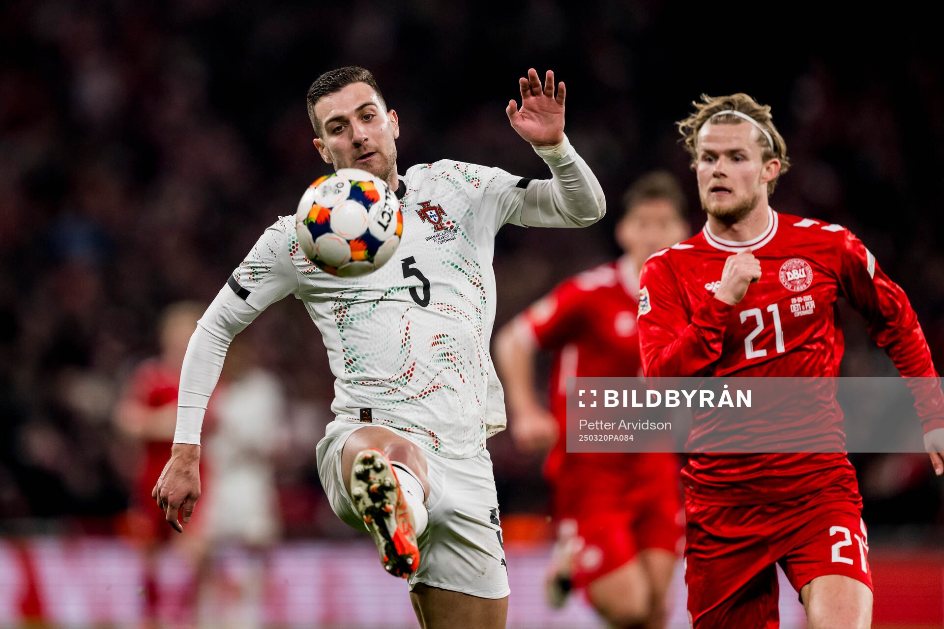 Diogo Dalot of Portugal and Morten Hjulmand of Denmark