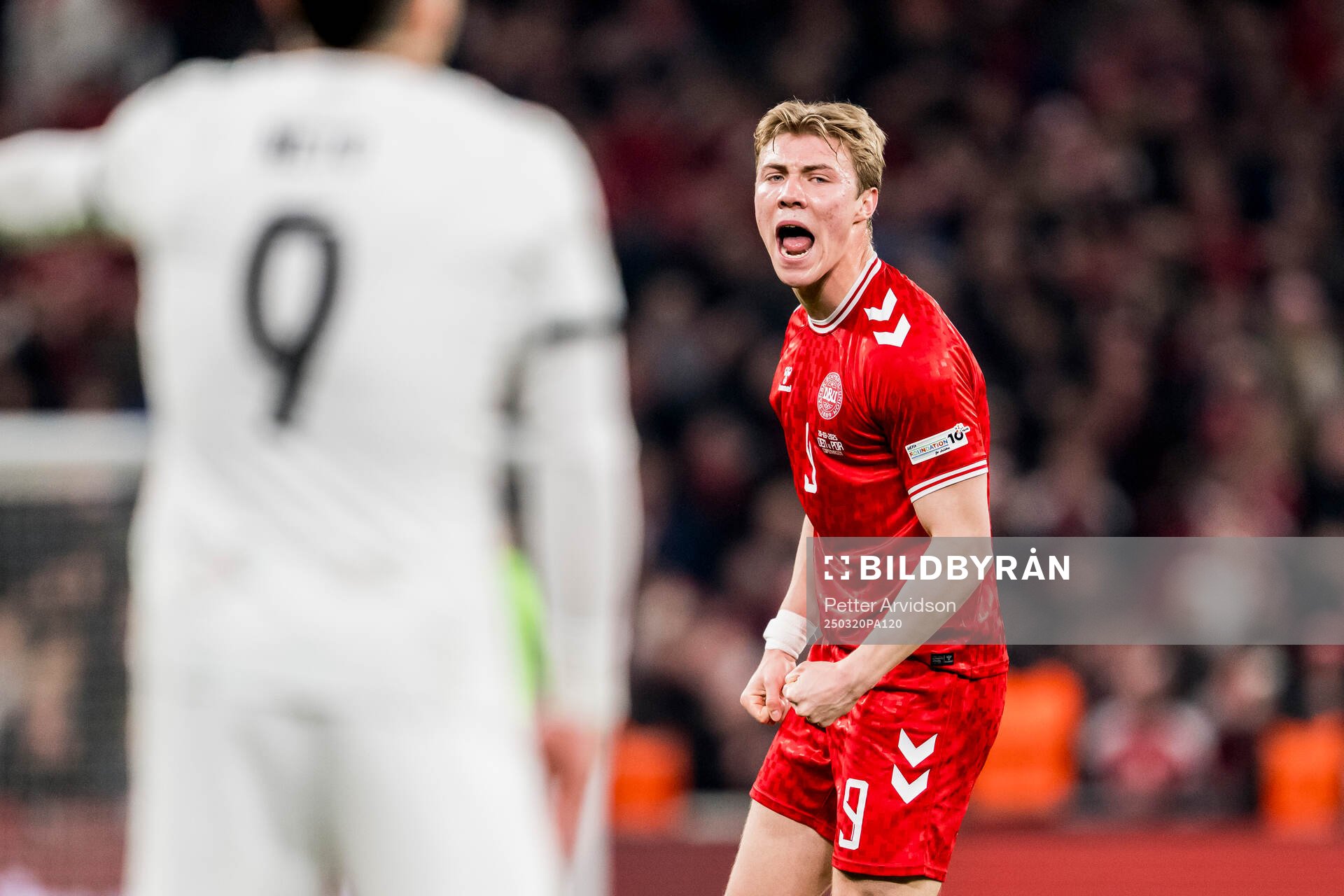 Rasmus Højlund of Denmark celebrates