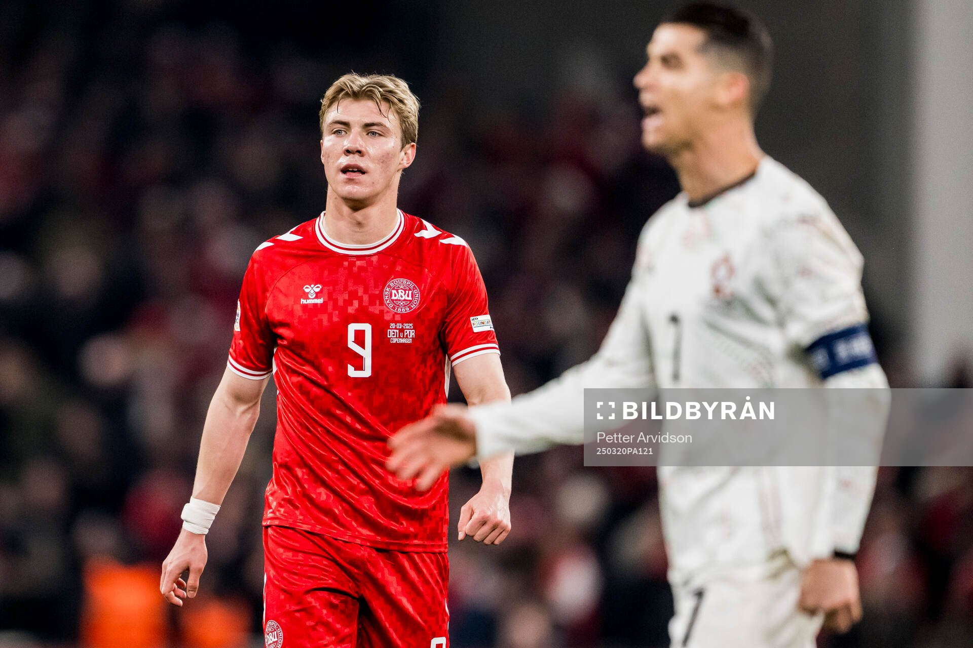 Rasmus Højlund of Denmark and Cristiano Ronaldo of Portugal