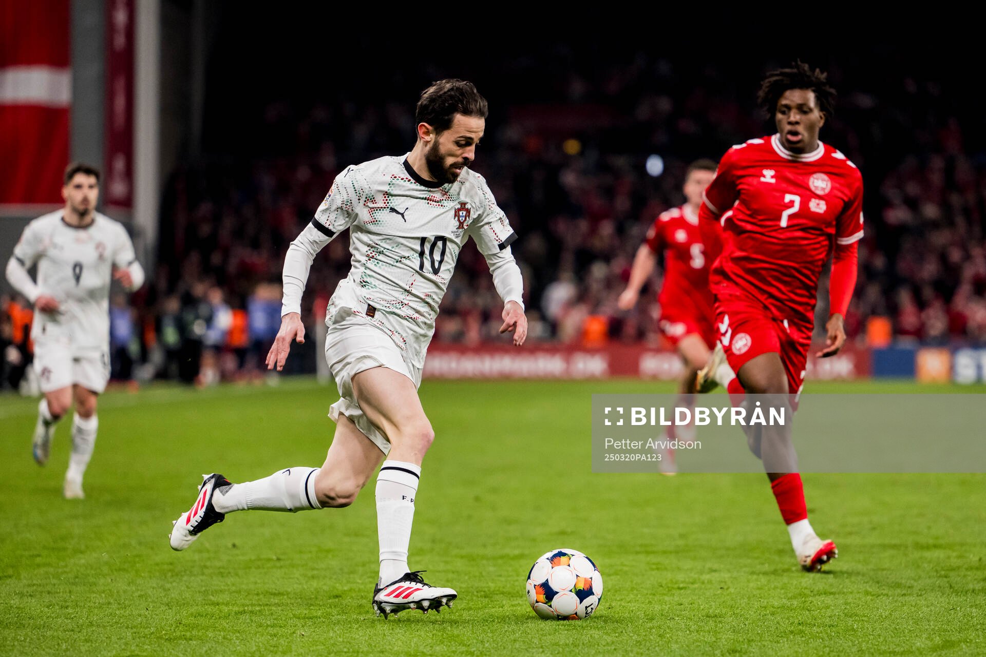 Bernardo Silva of Portugal and Patrick Dorgu of Denmark