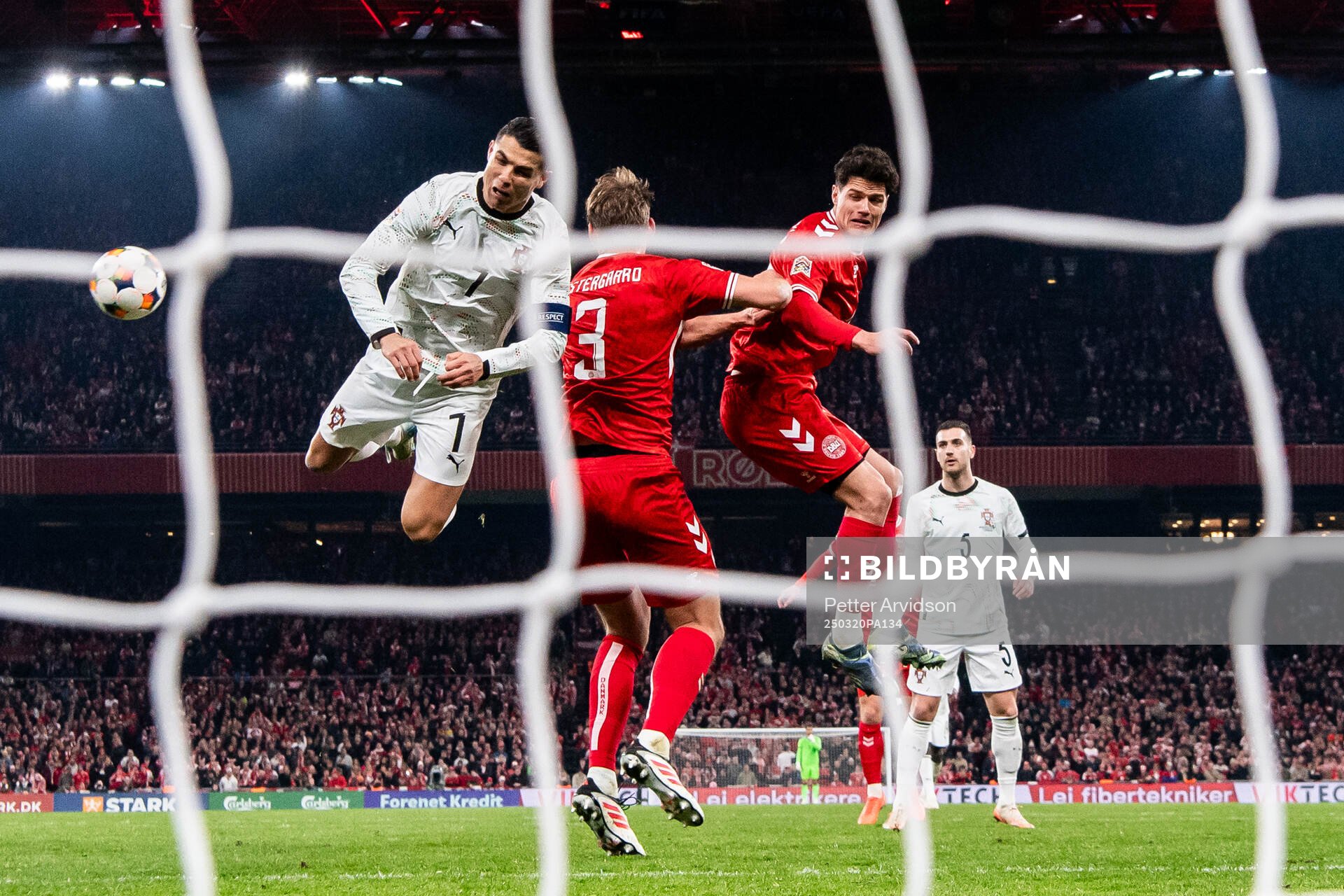 Cristiano Ronaldo of Portugal against Jannik Vestergaard an