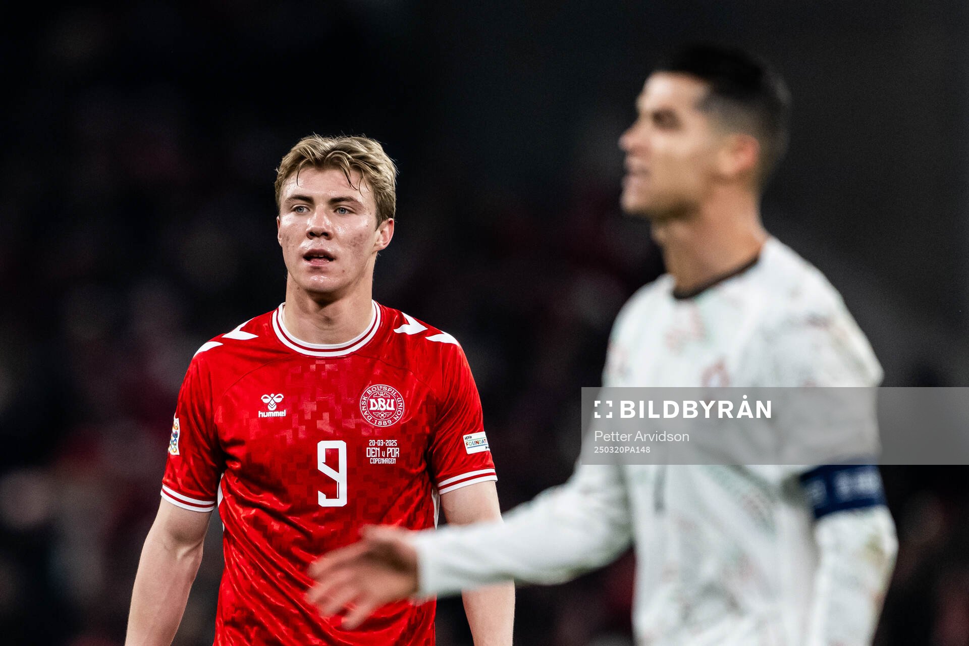 Rasmus Højlund of Denmark and Cristiano Ronaldo of Portugal