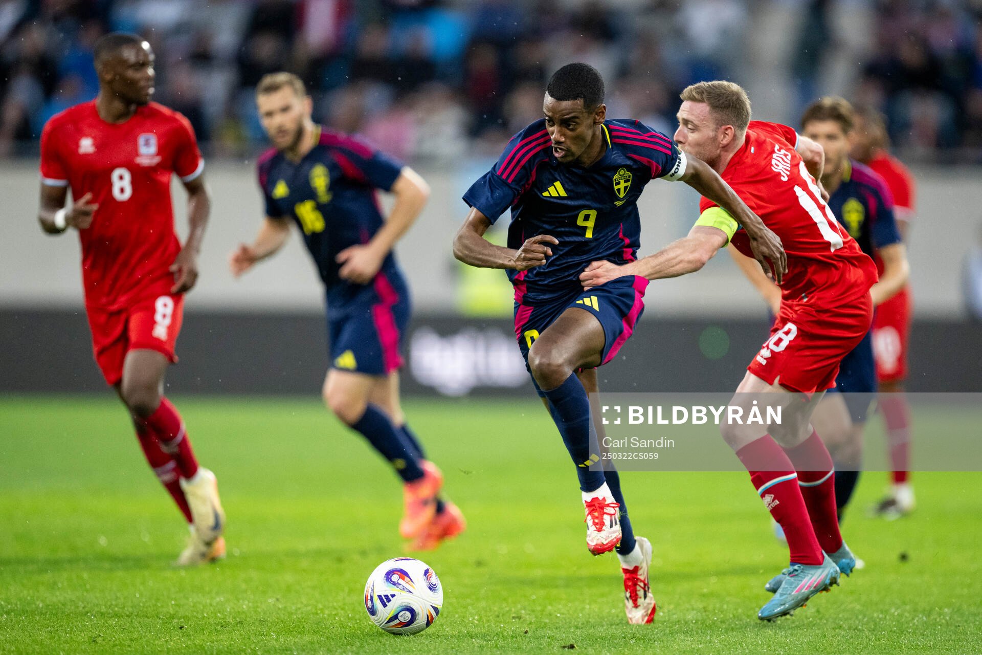 Alexander Isak of Sweden and Laurent Jans of Luxembourg