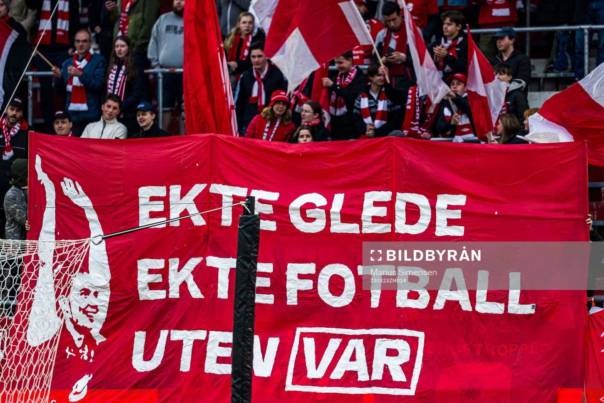 Spectators in the stands with a anti VAR banner