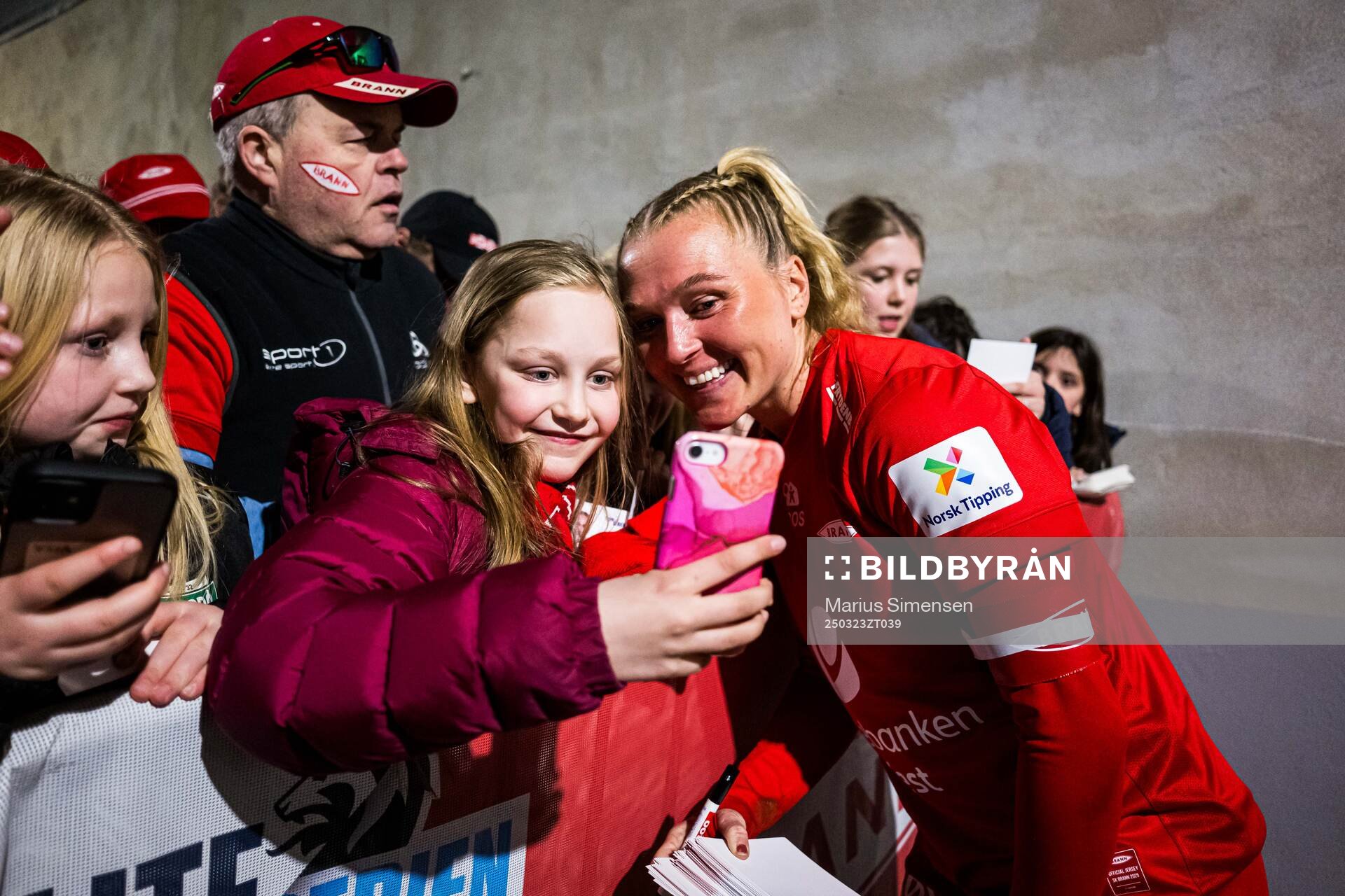 Karoline Haugland of Brann taking a selfie with a fan