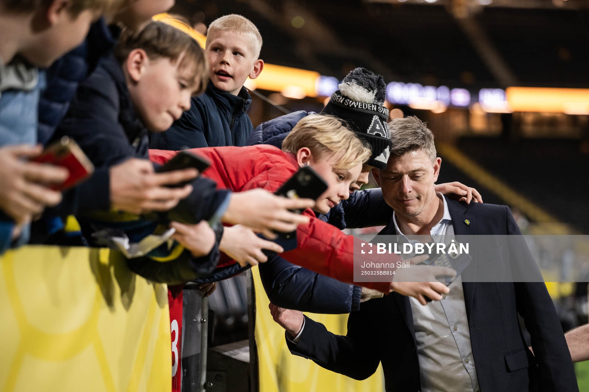 Head coach Jon Dahl Tomasson of Sweden takes selfies with