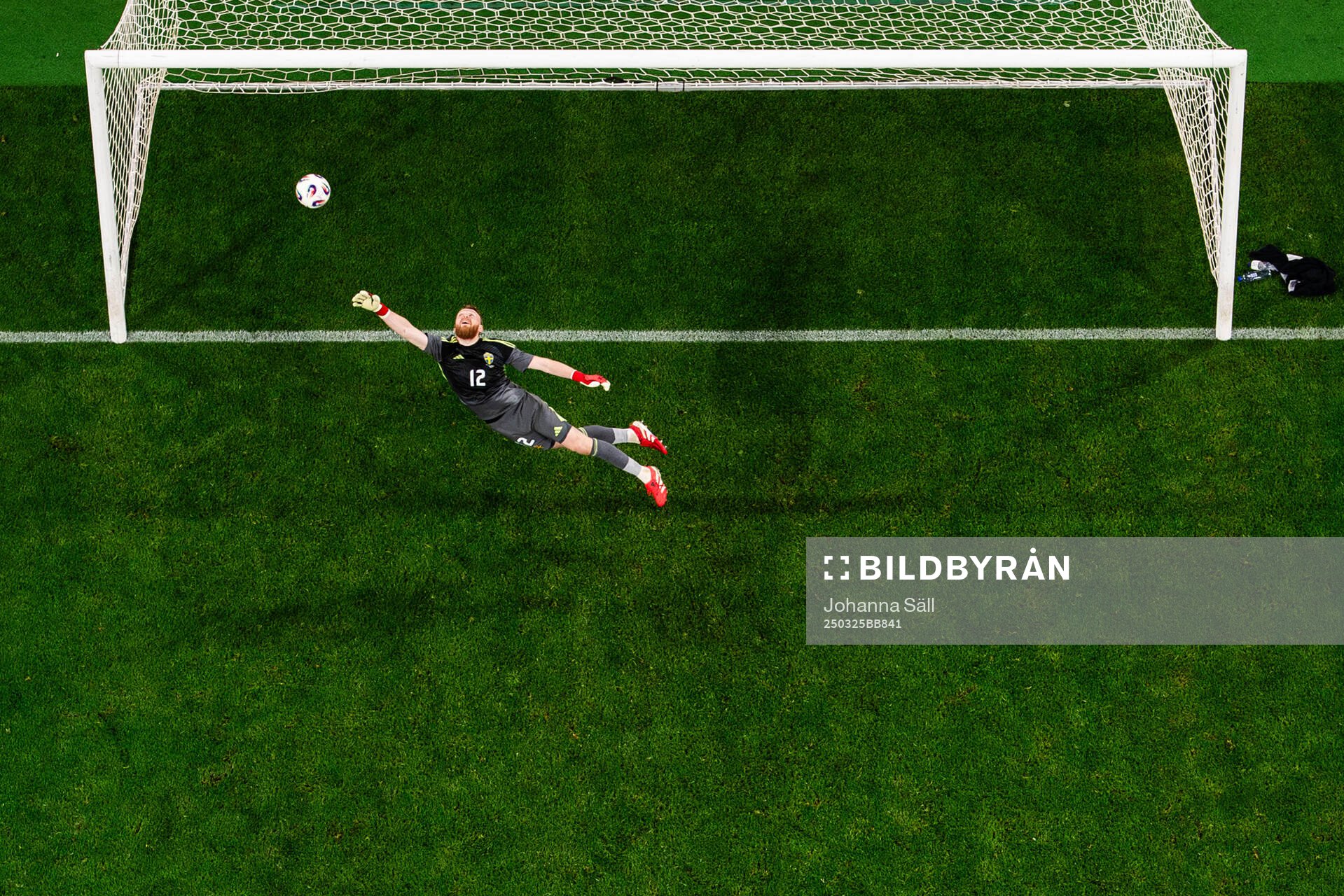 Goalkeeper Viktor Johansson of Sweden lets in the 5-1 goal by Isaac Price of Northern Ireland (not in picture) during the international friendly football match between Sweden and Northern Ireland on March 25, 2025 in Stockholm.