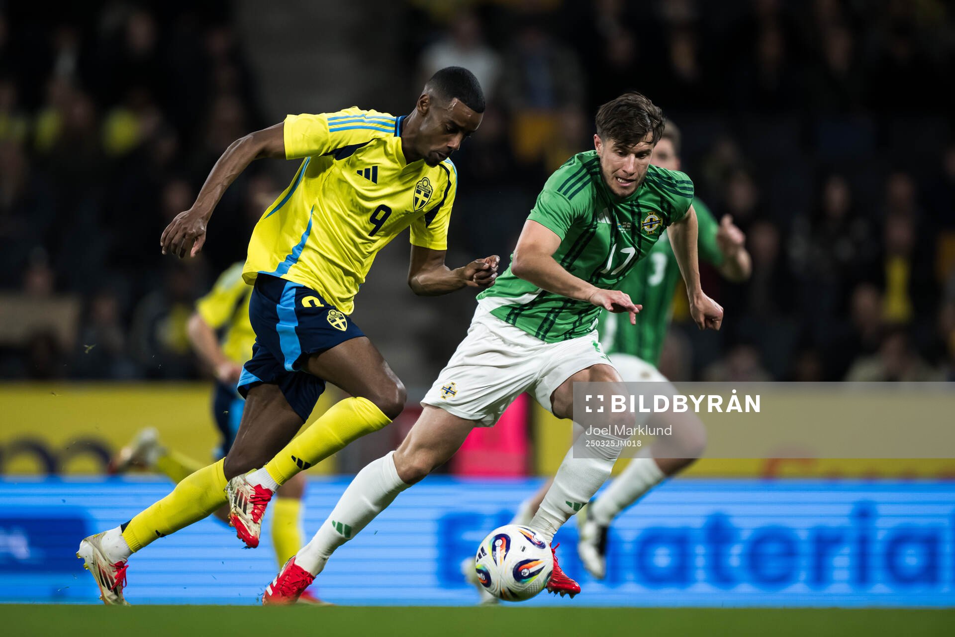 Alexander Isak of Sweden and Paddy McNair of Northern