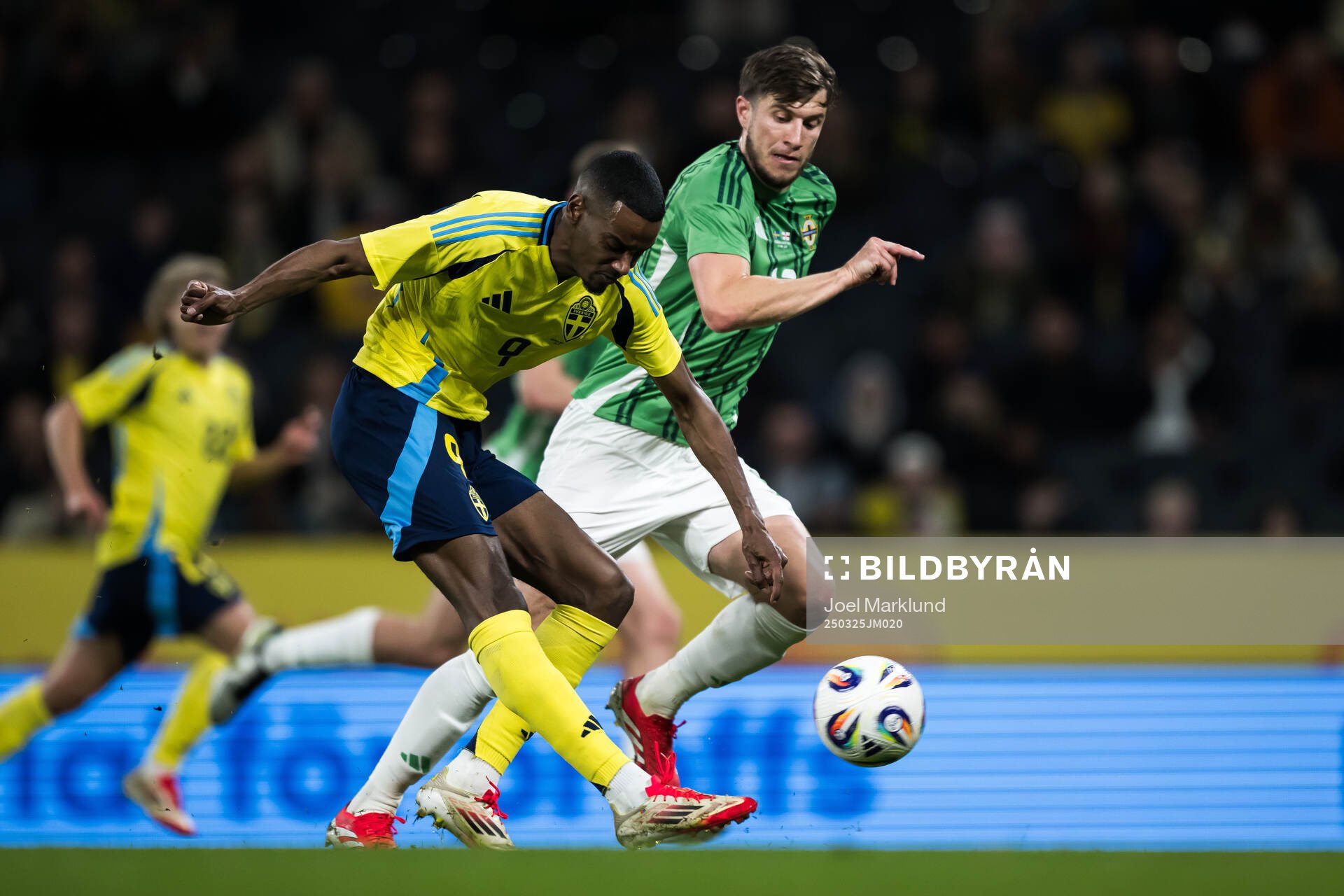 Alexander Isak of Sweden and Paddy McNair of Northern