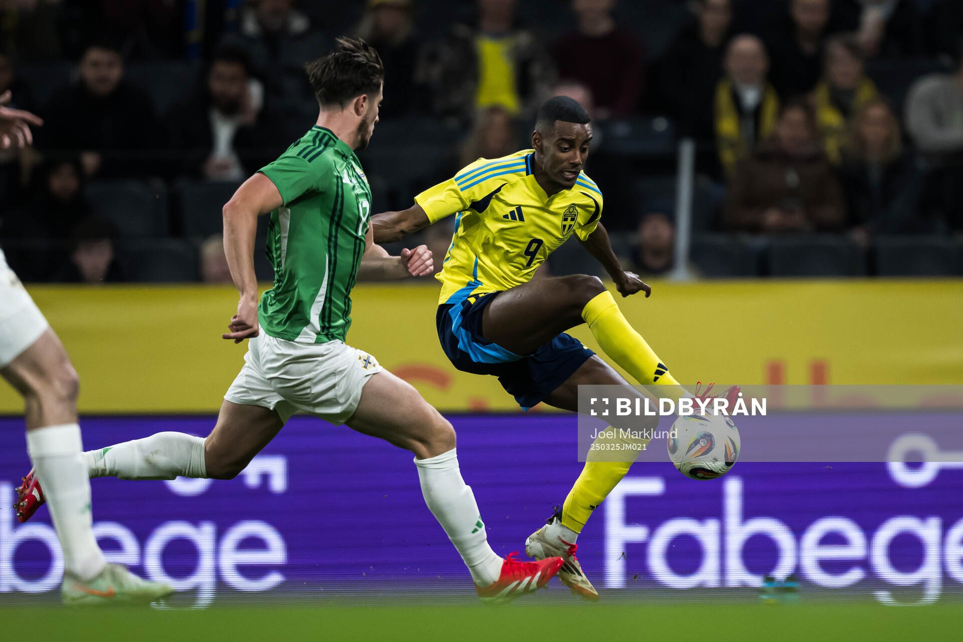 Paddy McNair of Northern Ireland and Alexander Isak of