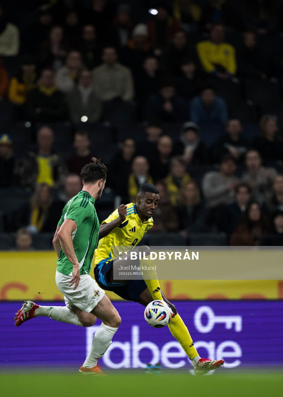 Paddy McNair of Northern Ireland and Alexander Isak of