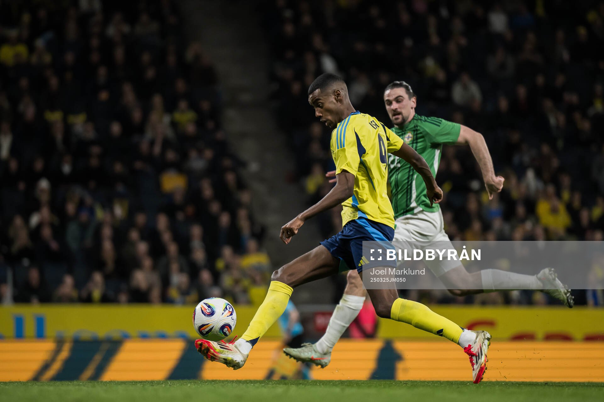 Alexander Isak of Sweden and Ciaron Brown of Northern