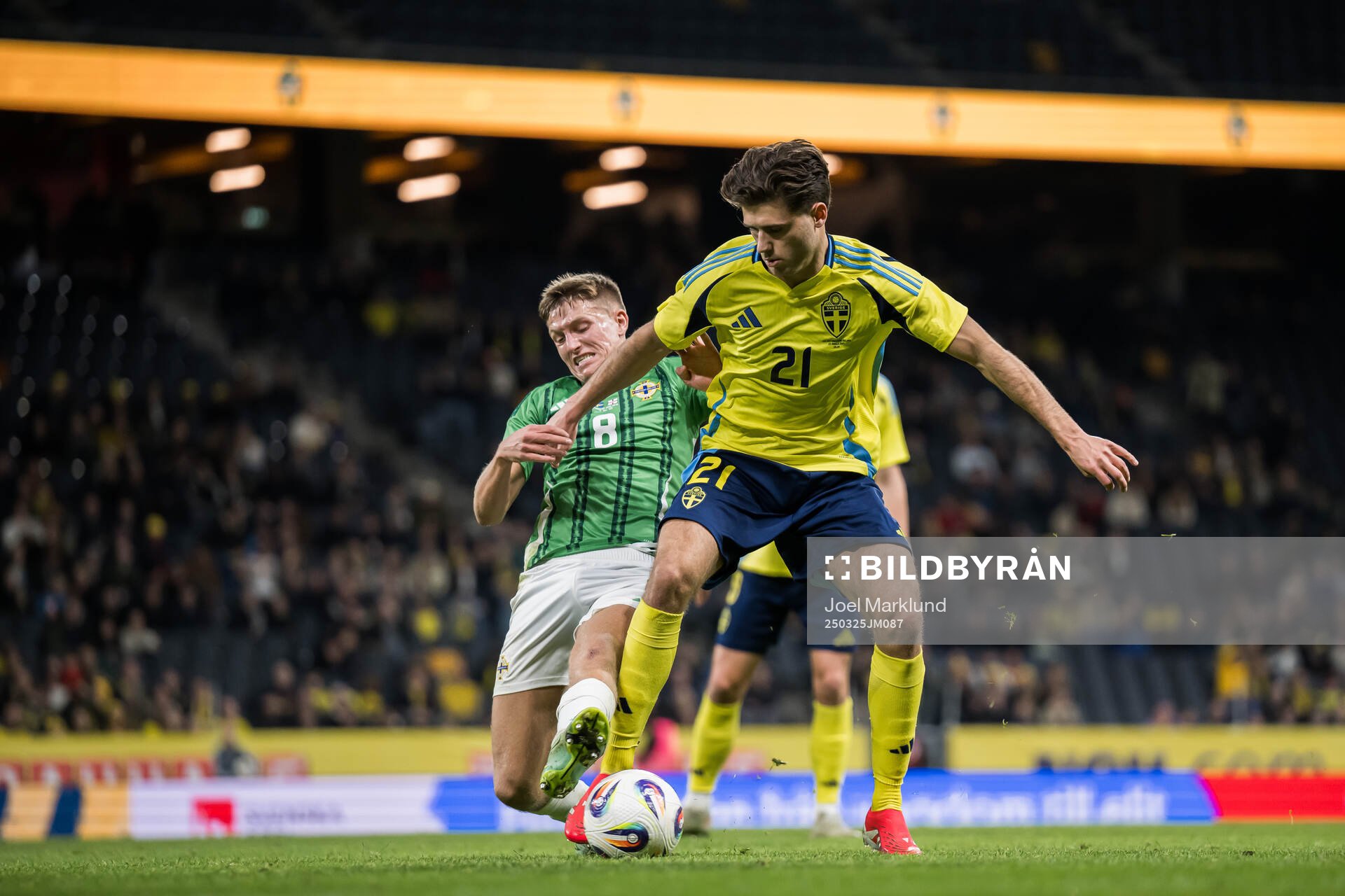 Callum Marshall of Northern Ireland and Besfort Zeneli of Sweden during the international friendly football match between Sweden and Northern Ireland on March 25, 2025 in Stockholm.