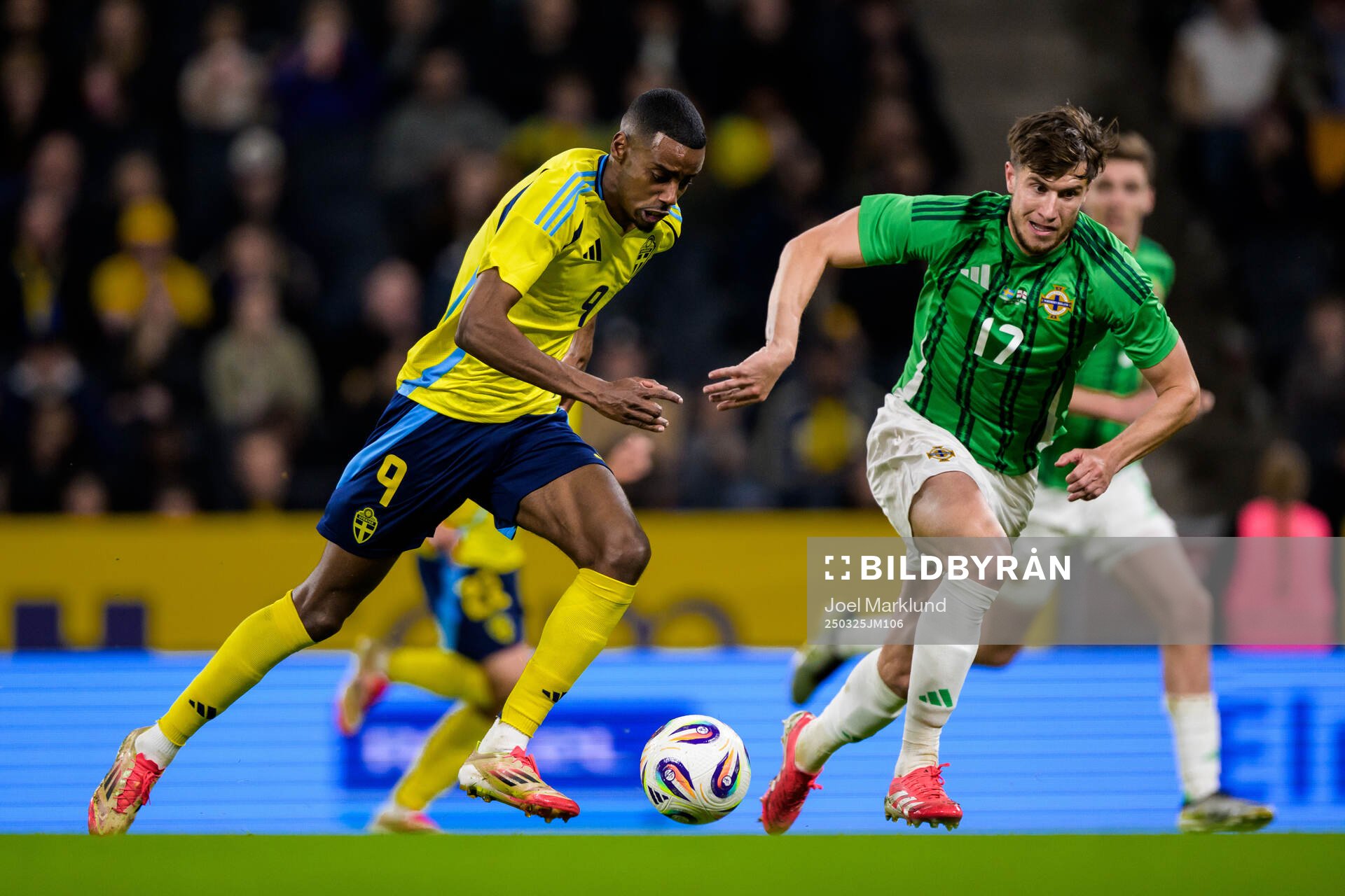 Alexander Isak of Sweden and Paddy McNair of Northern