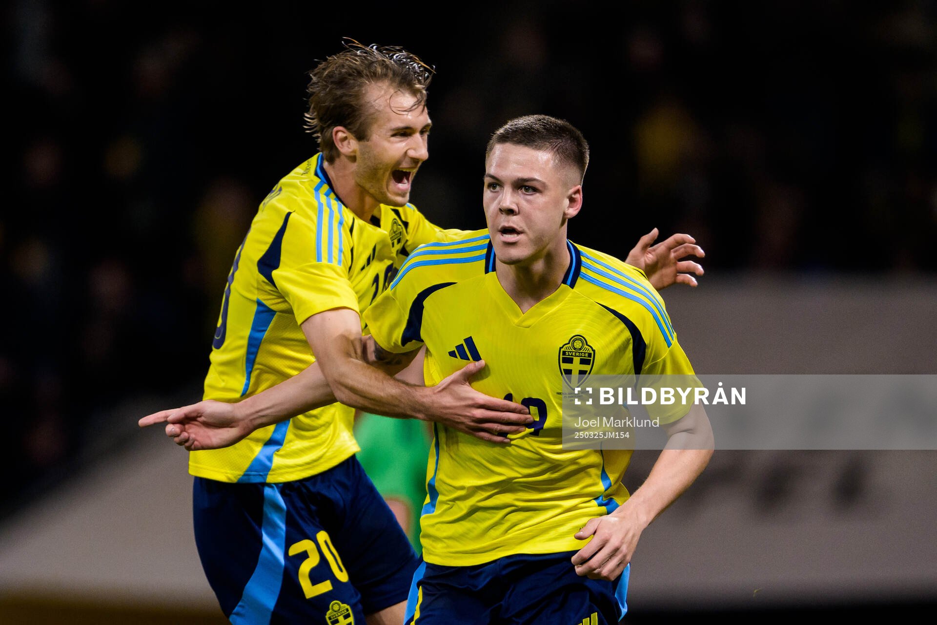 Benjamin Nygren and Emil Holm of Sweden celebrate the 1-0