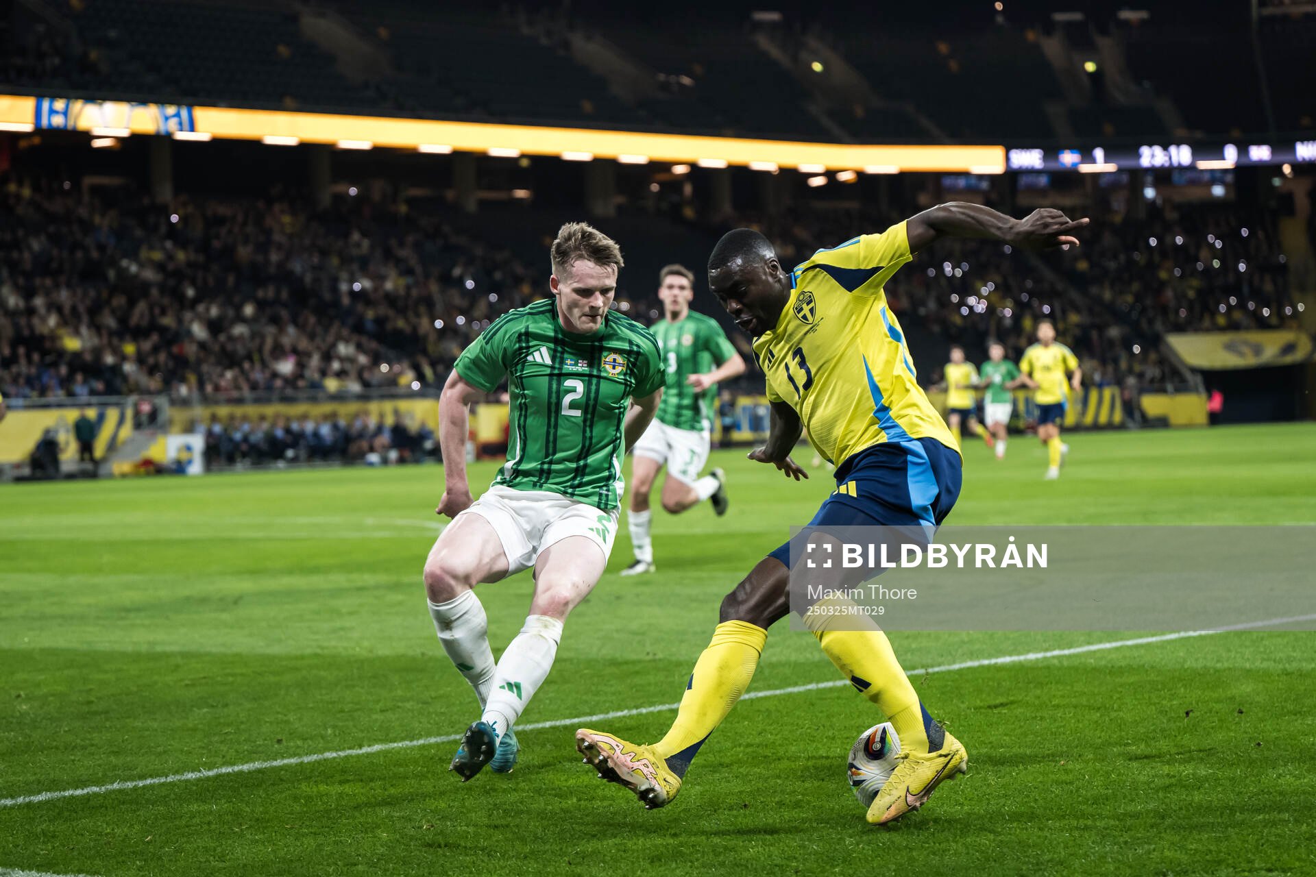 Terry Devlin of Northern Ireland and Ken Sema of Sweden