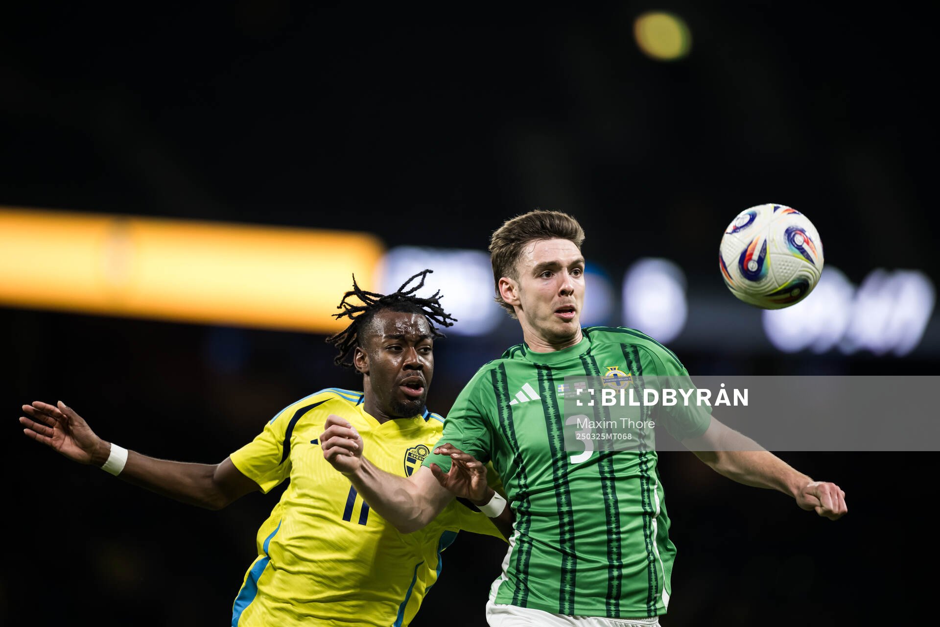 Anthony Elanga of Sweden and Ruairi McConville of Northern
