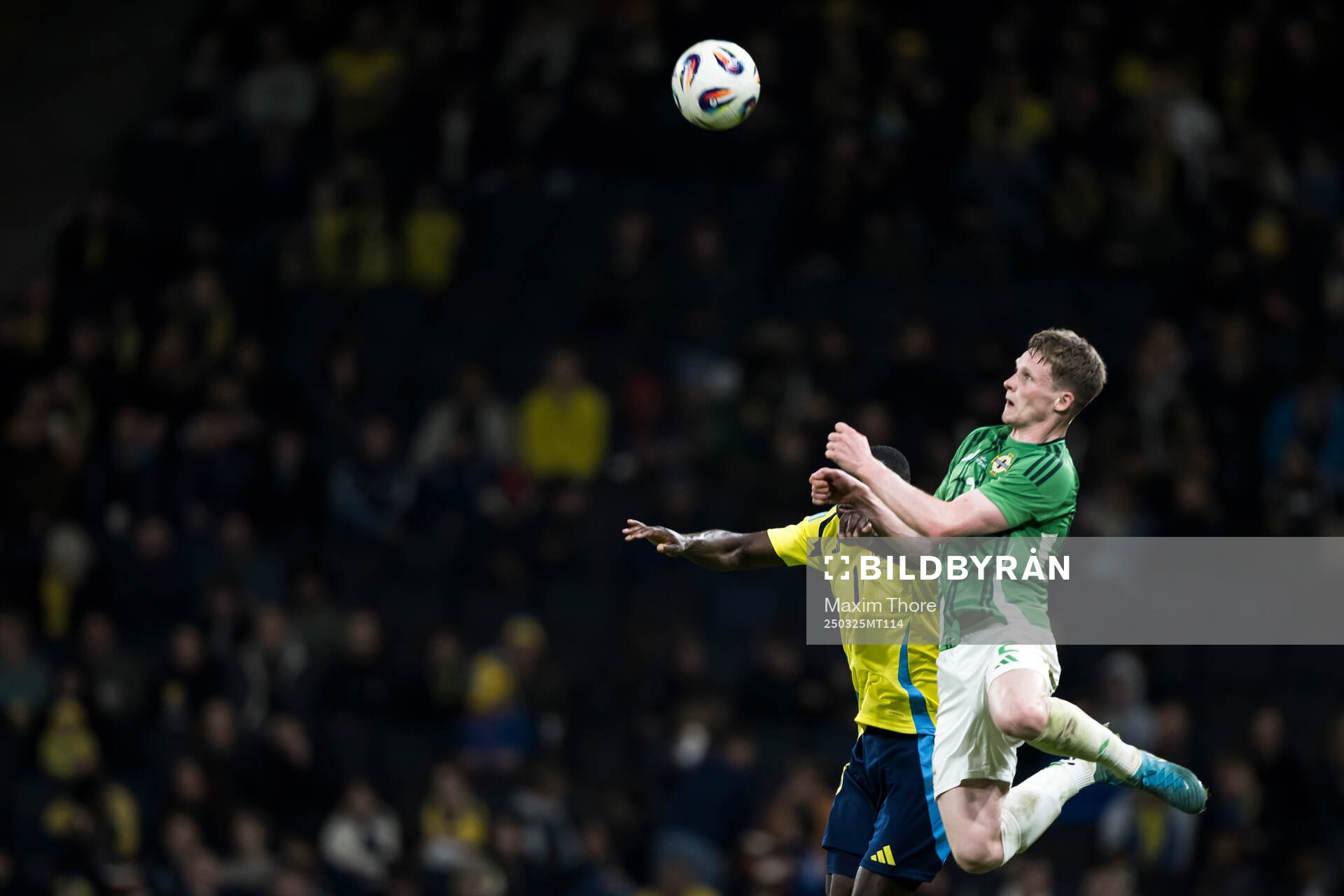 Terry Devlin of Northern Ireland and Ken Sema of Sweden during the international friendly football match between Sweden and Northern Ireland on March 25, 2025 in Stockholm.