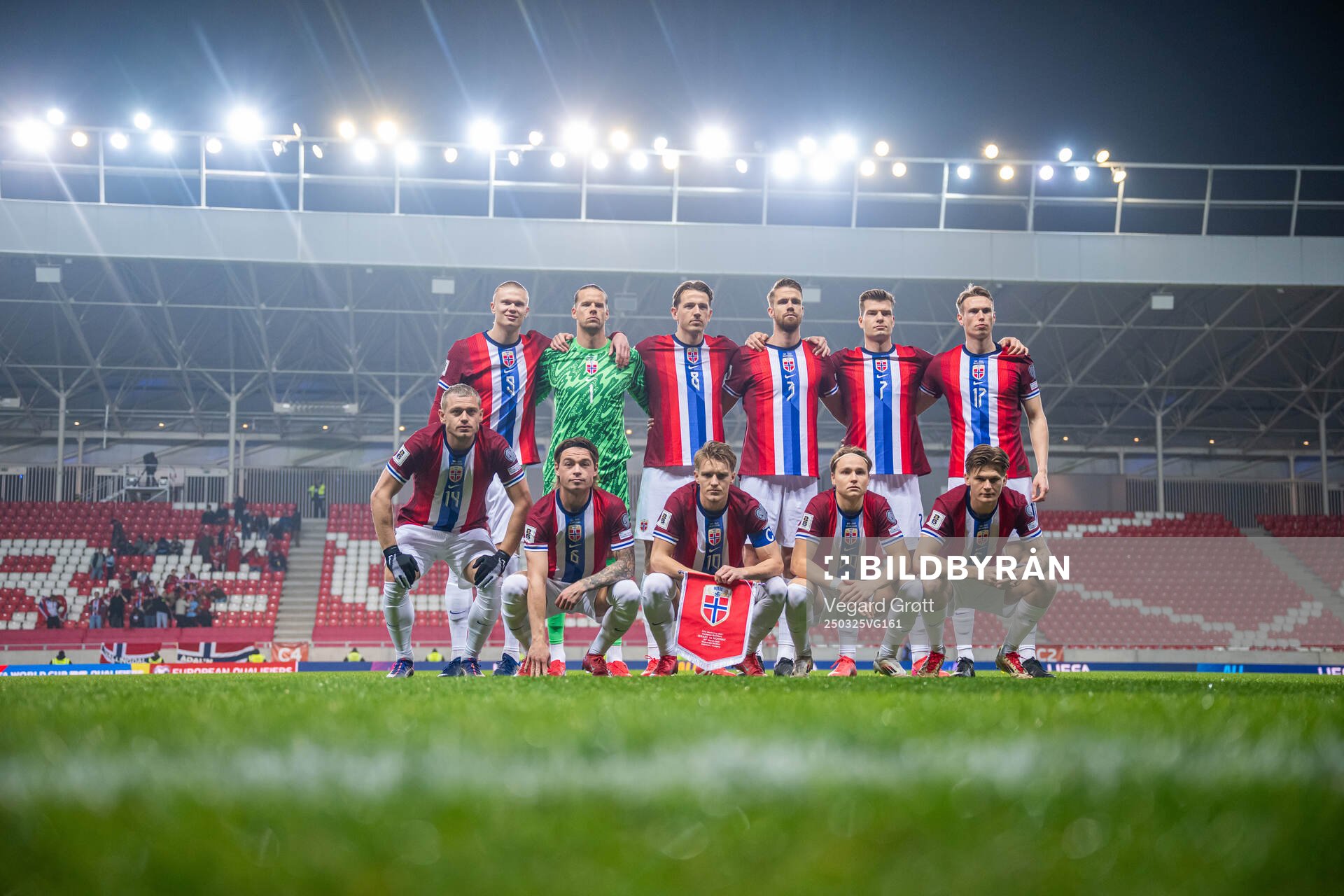 The starting eleven of Norway pose for a team photo ahead of the FIFA World Cup Qualifier football match between Israel and Norway on March 25, 2025 in Debrecen. Top left: Erling Braut Haaland, goalkeeper Ørjan Håskjold Nyland, Sander Berge, Kristoffer Ajer, Alexander Sørloth and Torbjørn Lysaker Heggem. Front left: Julian Ryerson, Patrick Berg, Martin Ødegaard, Andreas Schjelderup and David Møller Wolfe.
