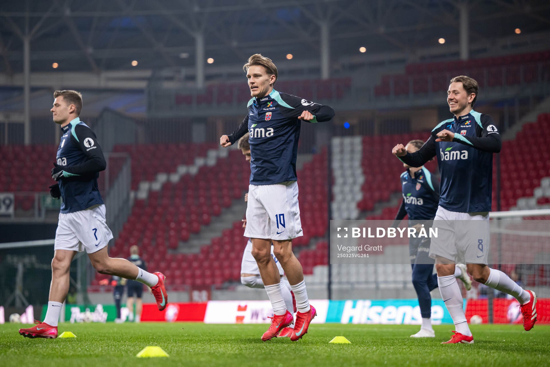 Martin Ødegaard and Sander Berge of Norway warm up