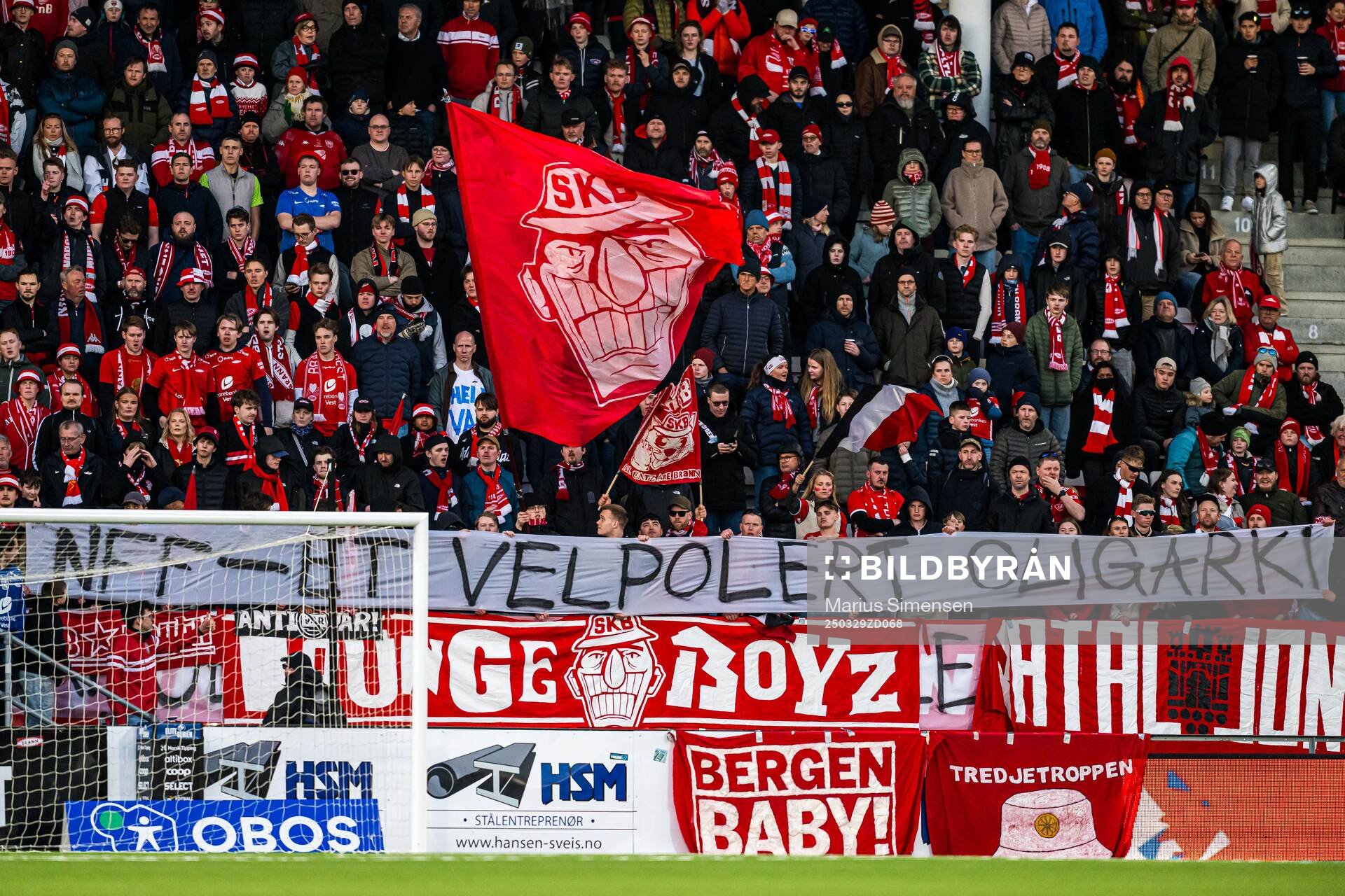 Spectators with a banner