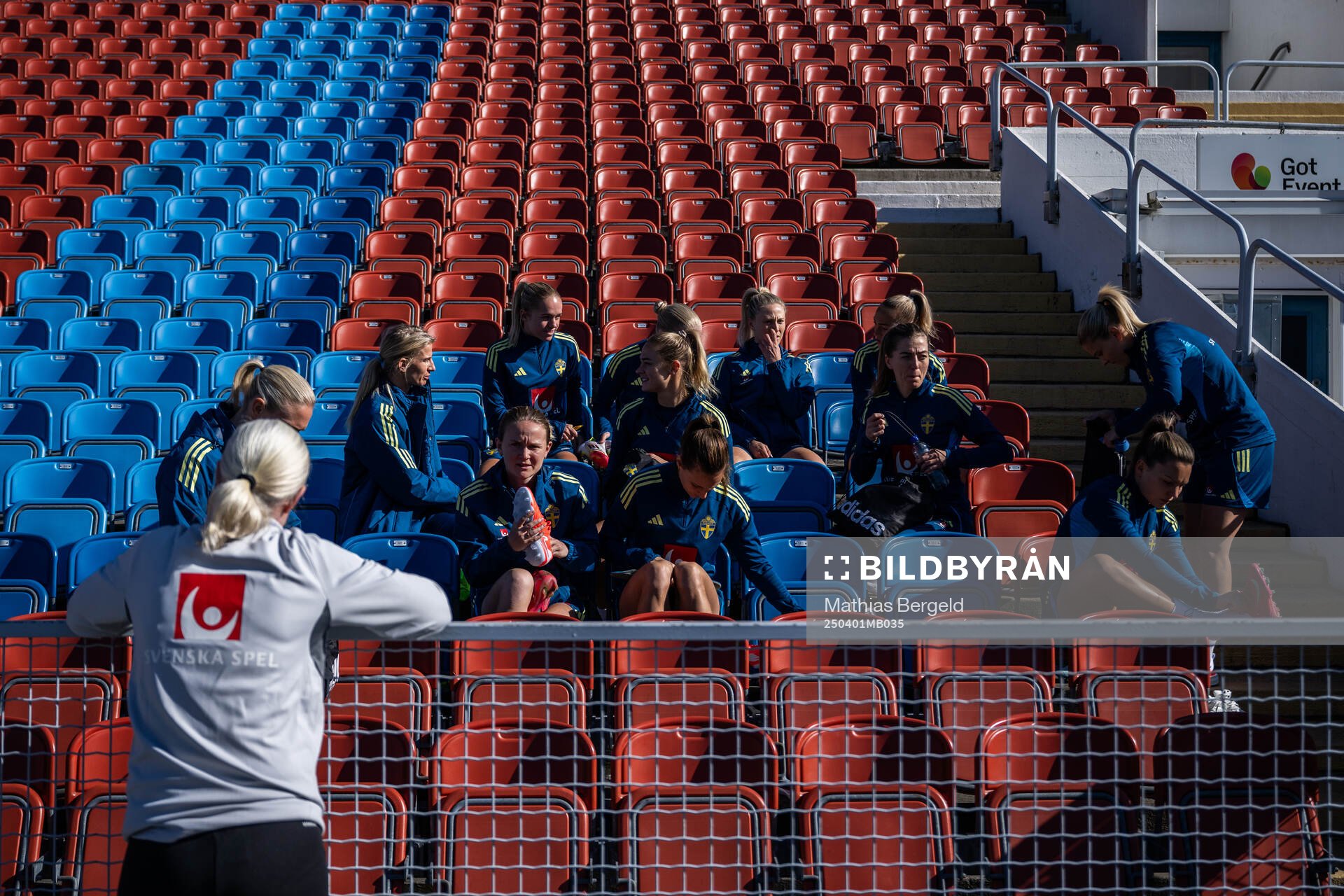 Players sit in the stands