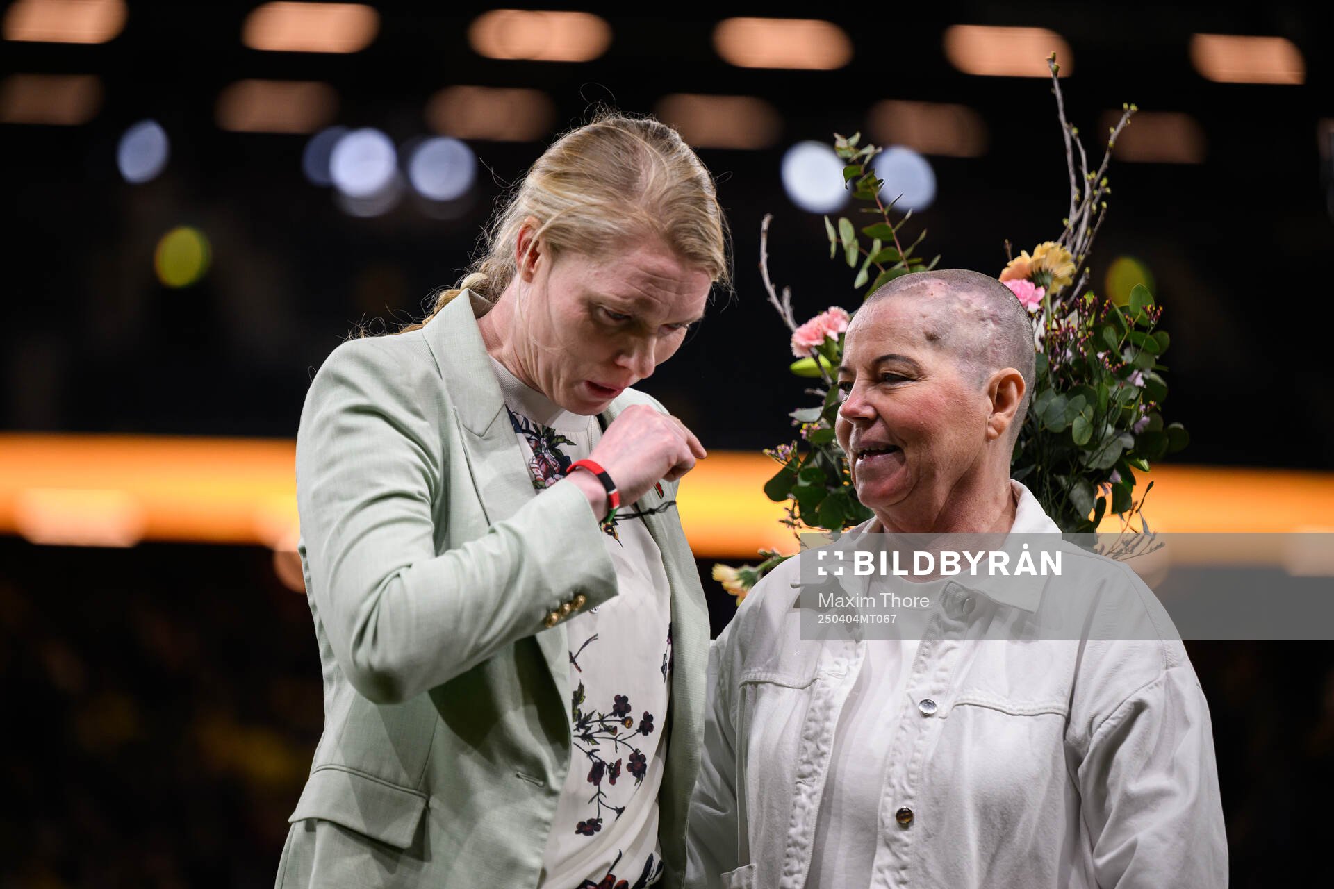 Former national team goalkeeper Hedvig Lindahl is celebrated and stands next to Marika Domanski Lyfors during the UEFA Women's Nations League football match between Sweden and Italy on April 4, 2025 in Stockholm.