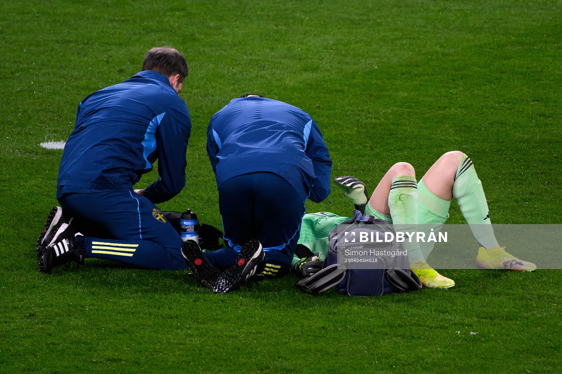 Goalkeeper Jennifer Falk of Sweden receives medical attention during the UEFA Women's Nations League football match between Sweden and Italy on April 4, 2025 in Stockholm.