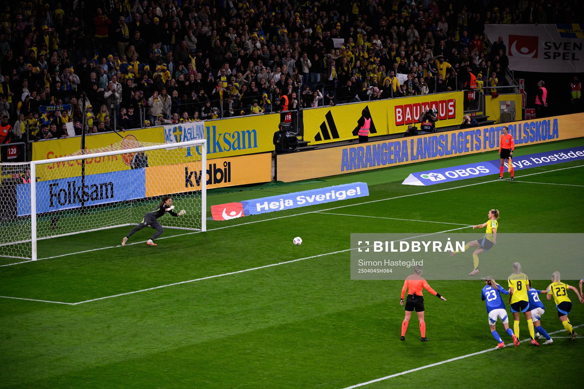 Fridolina Rolfö of Sweden scores 3-2 behind goalkeeper